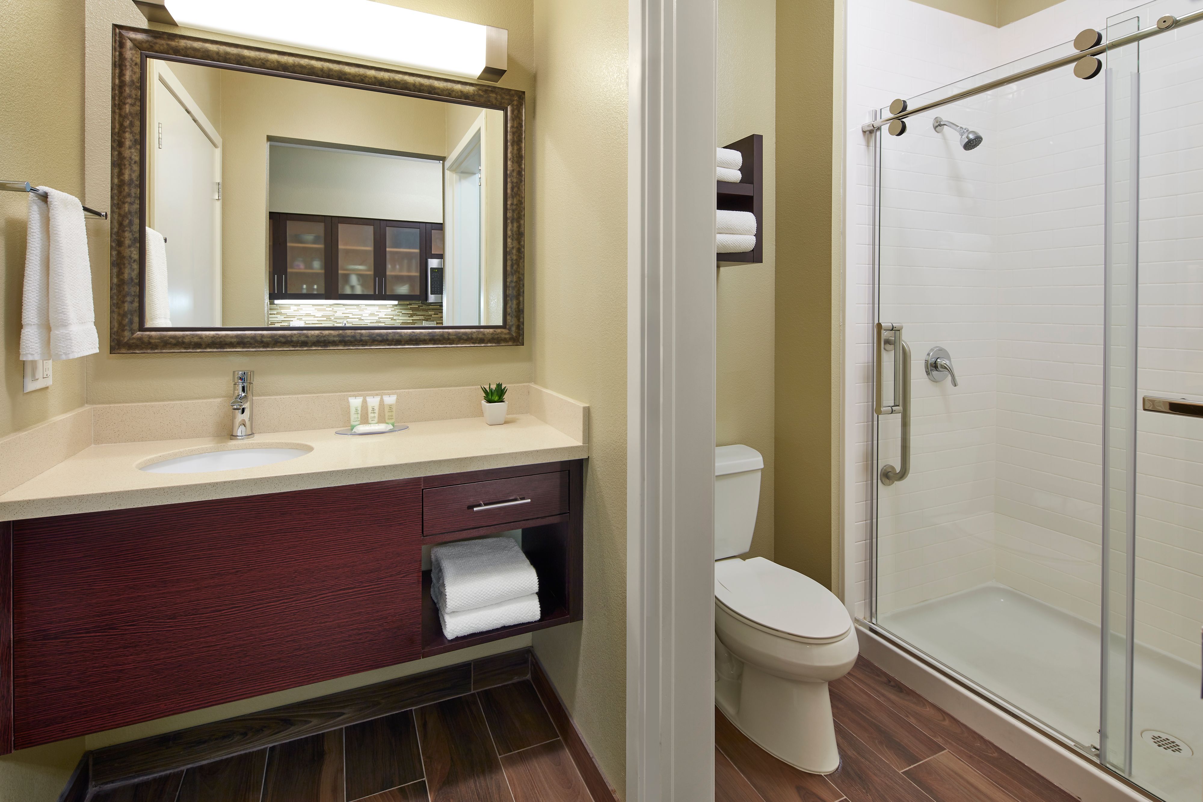 image Sleek glass shower enclosure and modern bathroom vanity.