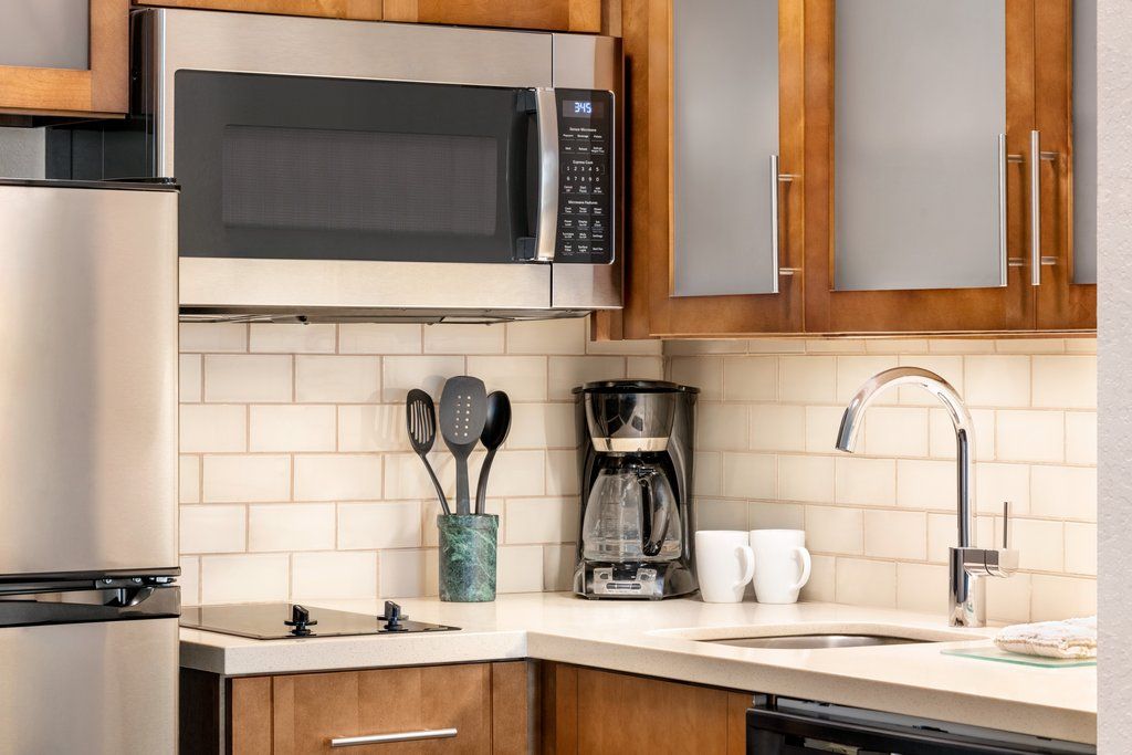 image The fully equipped kitchen showcases modern appliances, perfect for preparing meals during your stay.