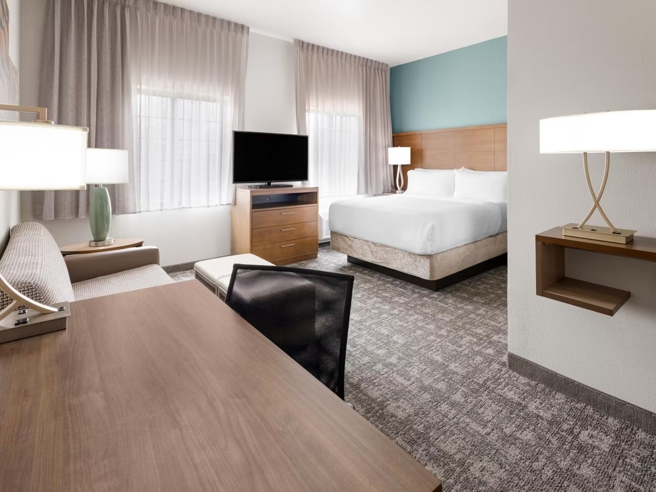 image Cozy studio with plush queen bed, flat-screen and work desk.