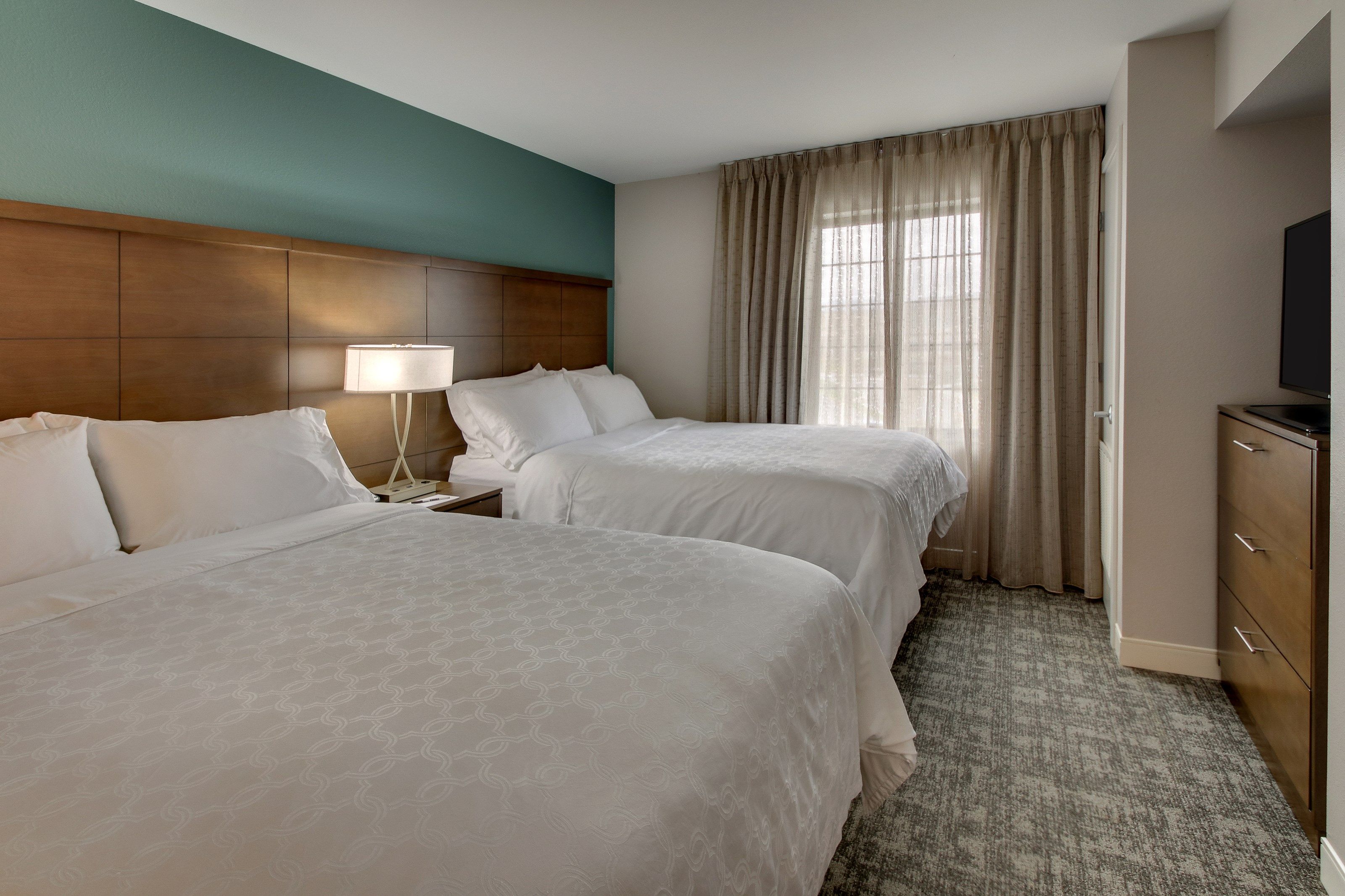 image Drift to sleep in a comfortable bed after a busy day.