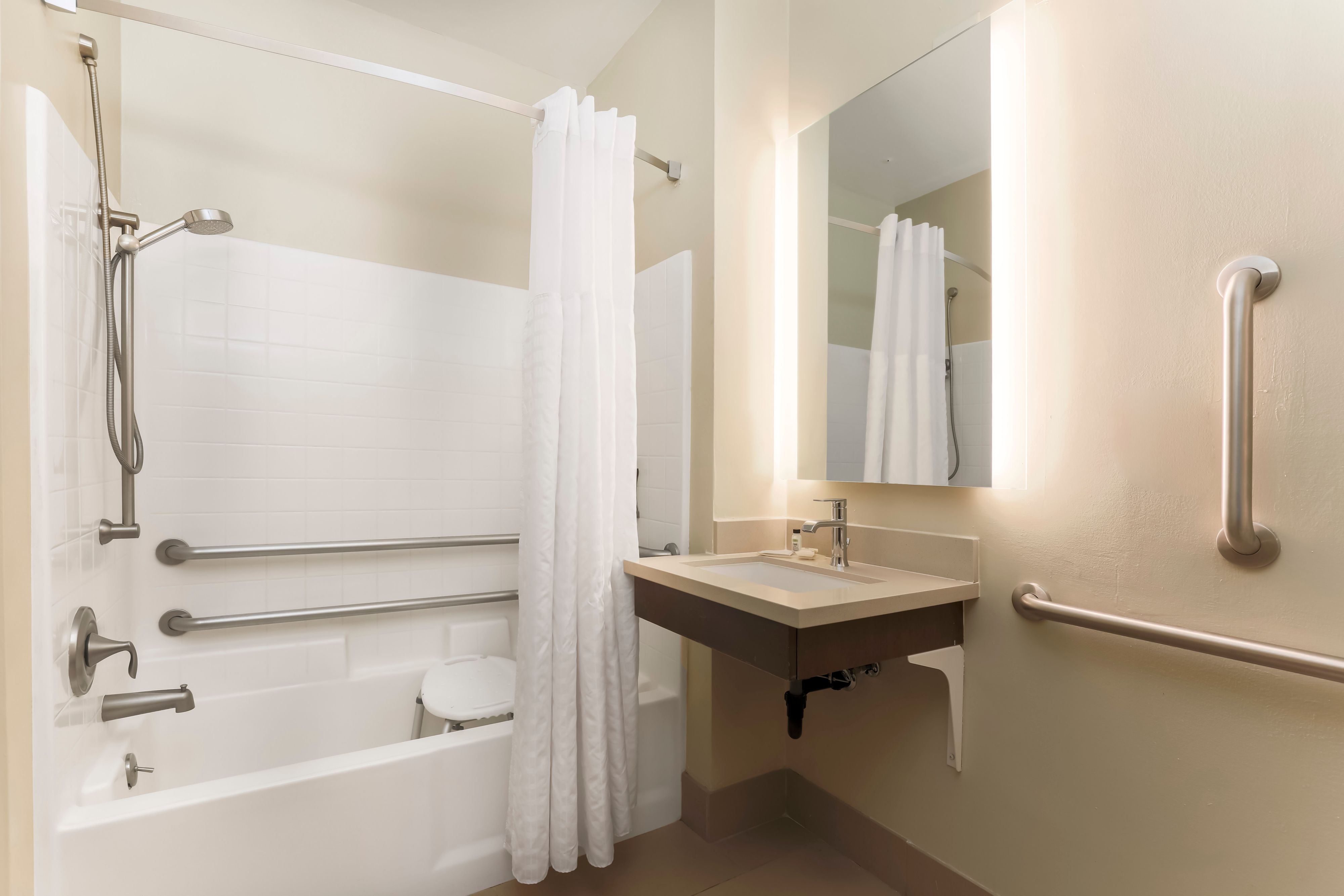 image Shower with confidence thanks to safety grab rails in the accessible bathroom.