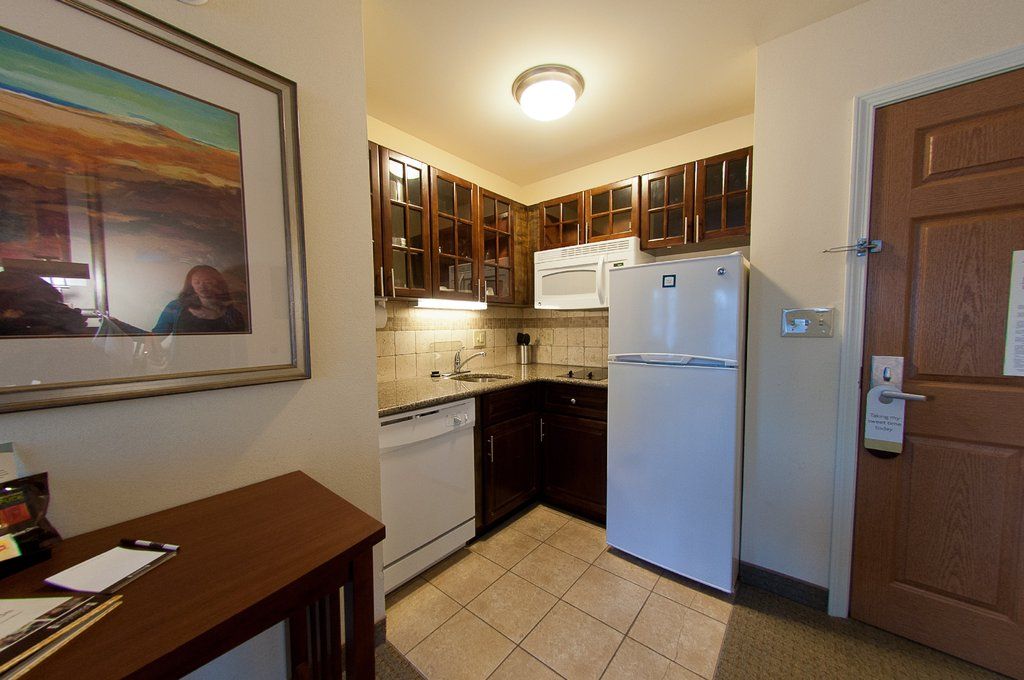 image Cook up a storm in this fully equipped kitchenette, complete with modern appliances and ample counter space.