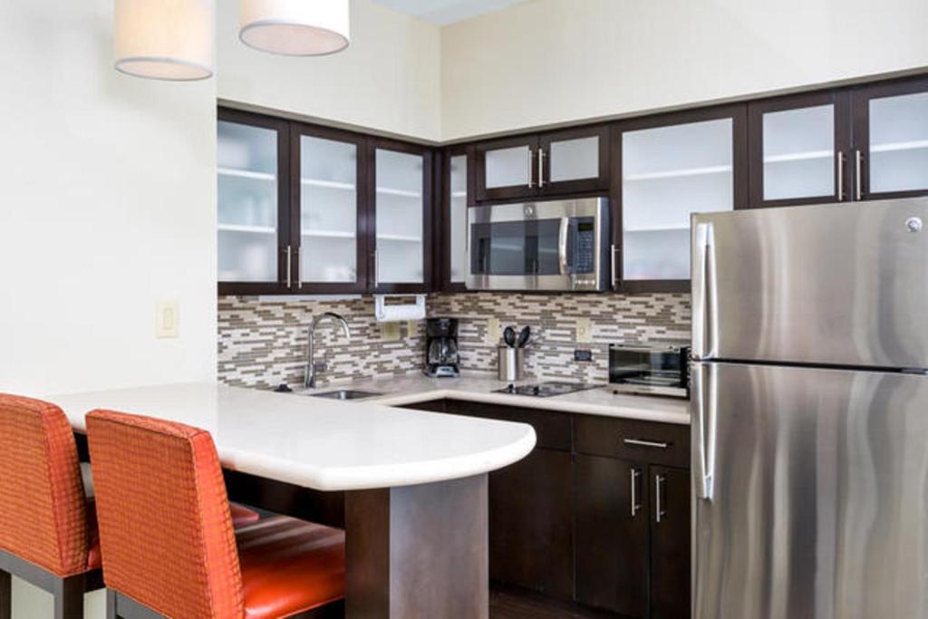 image Curb your appetite by cooking a meal in your kitchen.