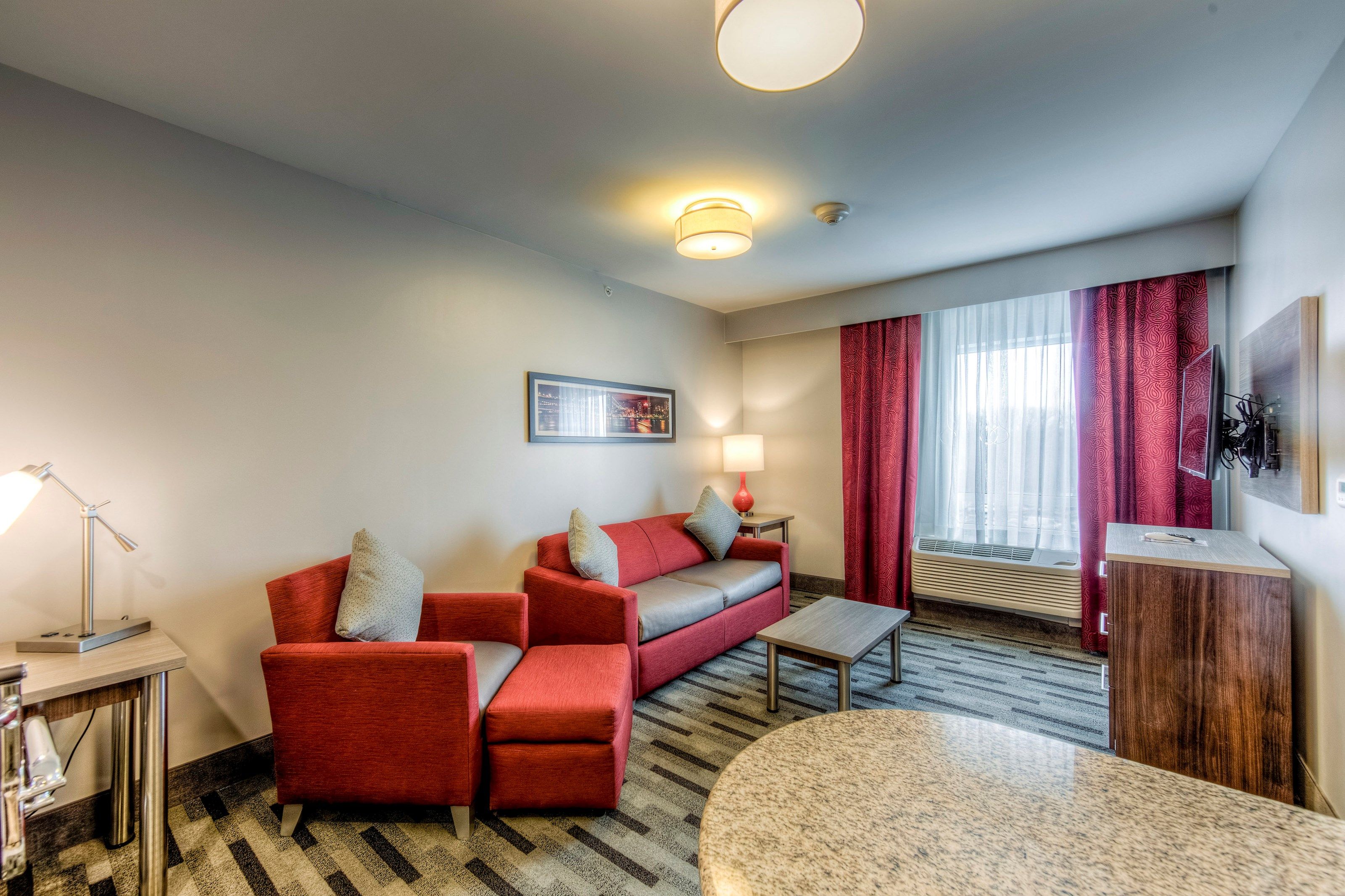 image Relax and unwind in the cozy, well-appointed living room.