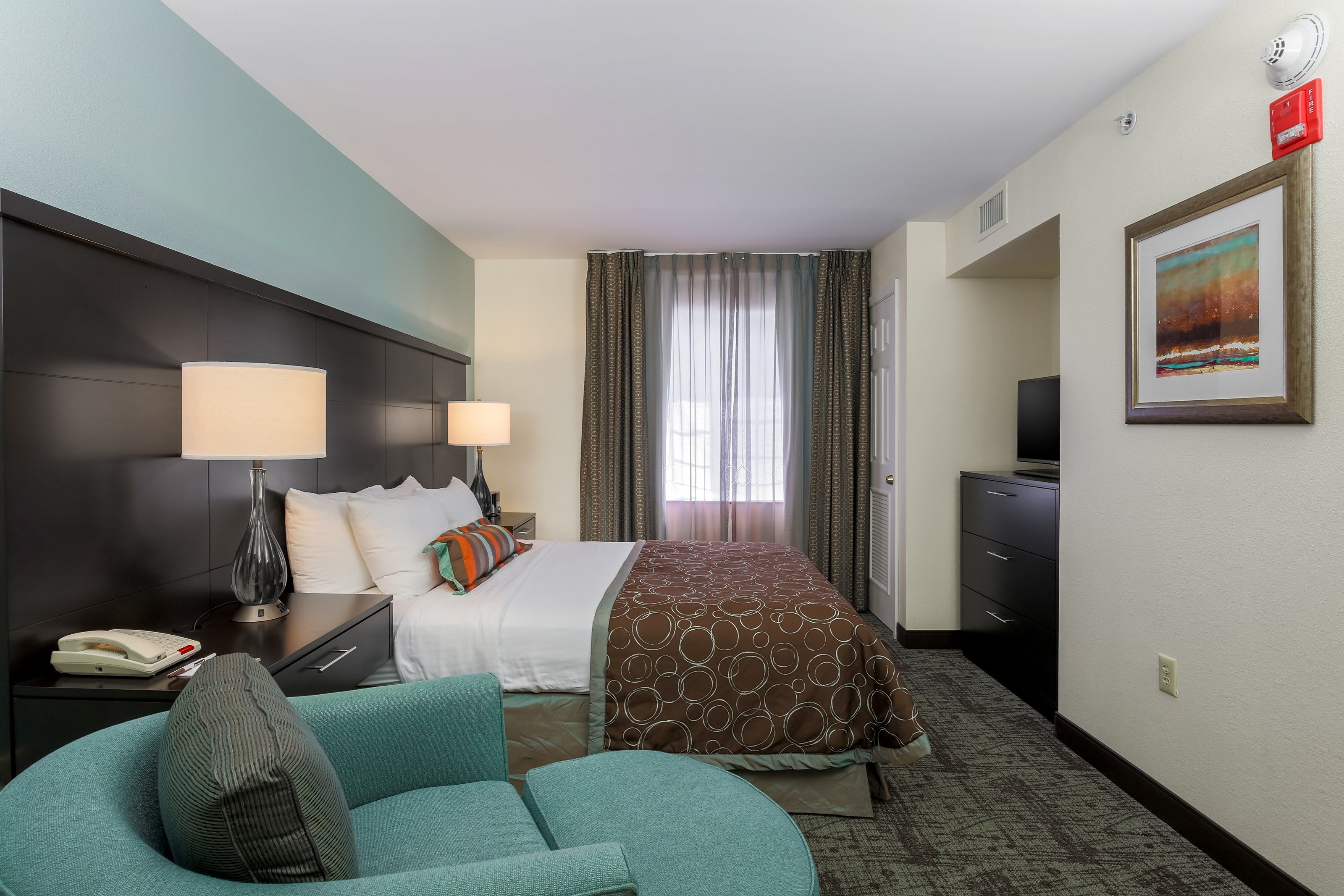 image Get a peaceful night sleep in our cozy bedroom which has 1 Queen bed.