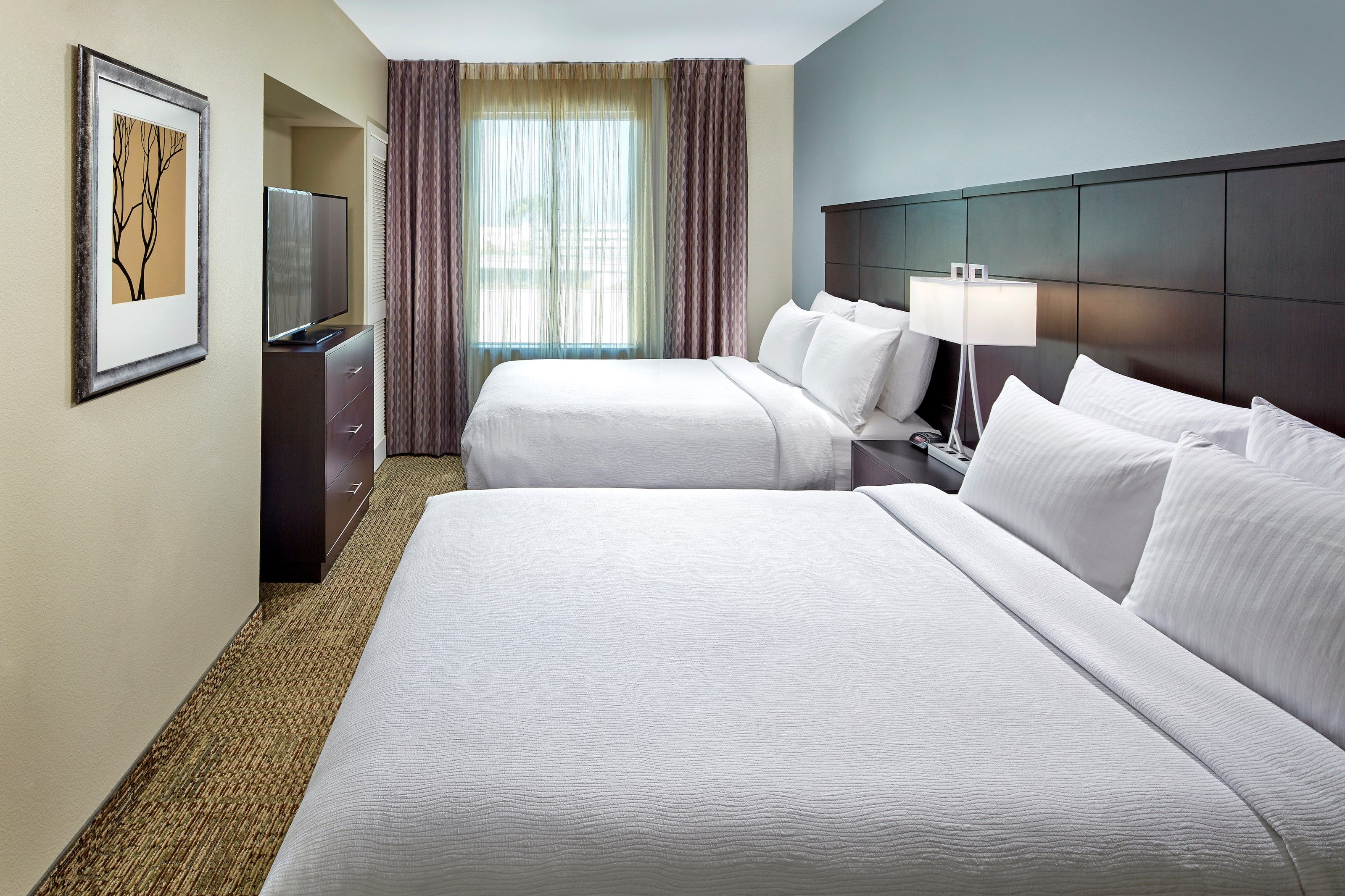 image Drift to sleep in a comfortable bed after a busy day.