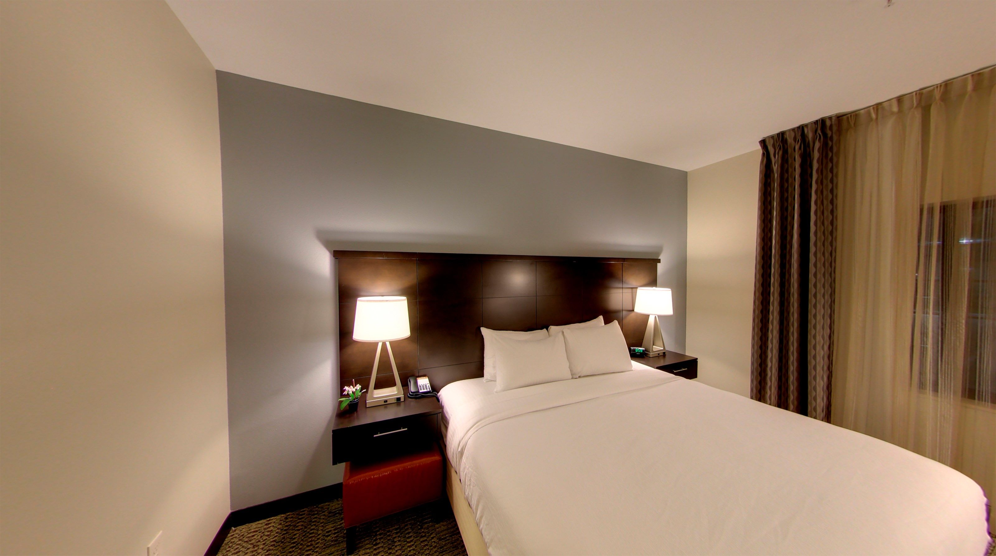 image Drift to sleep in a comfortable bed after a busy day.