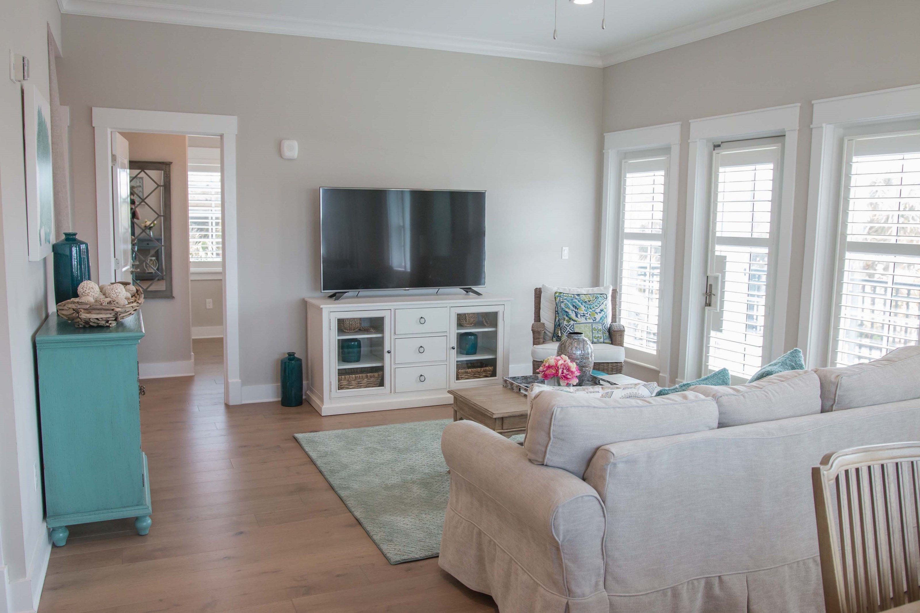 image Find peace and relaxation with your close friends and family in this stunning living room featuring natural decor.