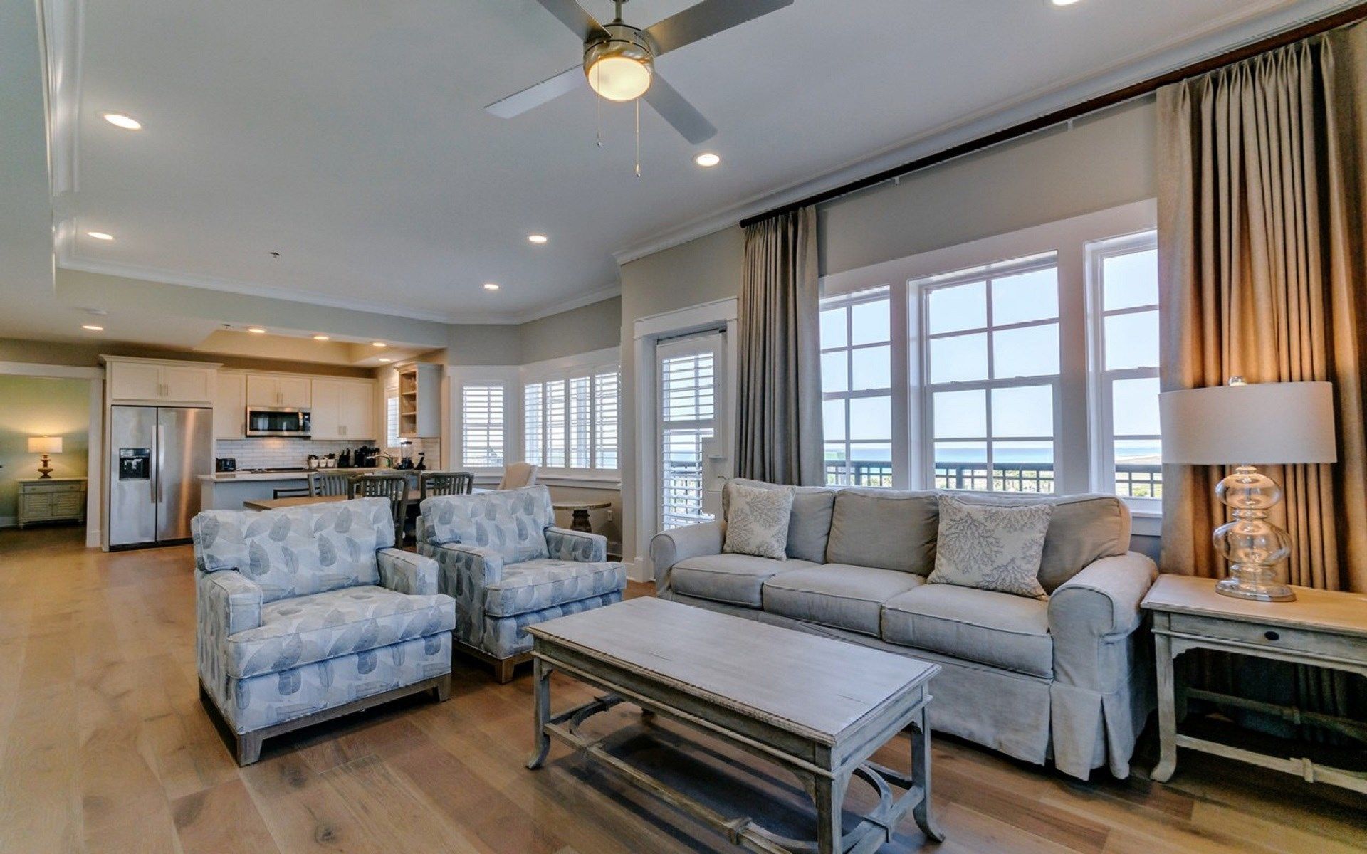 image Find peace and relaxation with your close friends and family in this stunning living room featuring natural decor.