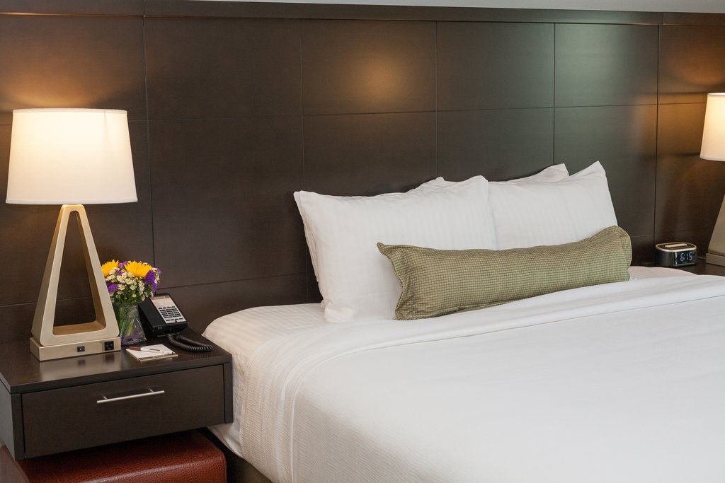 image Rest easy in a sophisticated bedroom with crisp linens, warm lighting, and thoughtfully designed comfort.