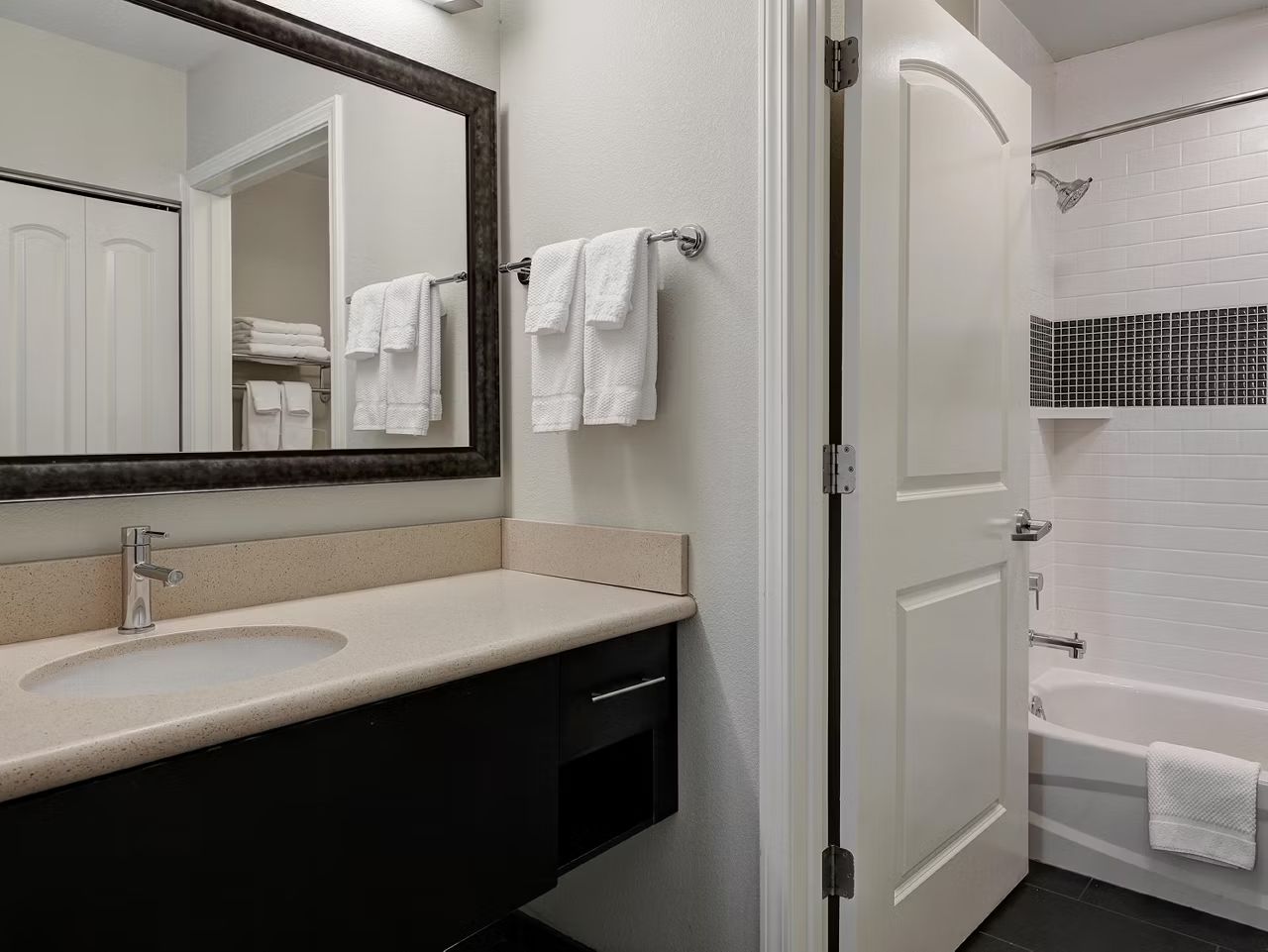 image Get ready for the day in a spacious bathroom, which can have either a tub or walk-in shower.