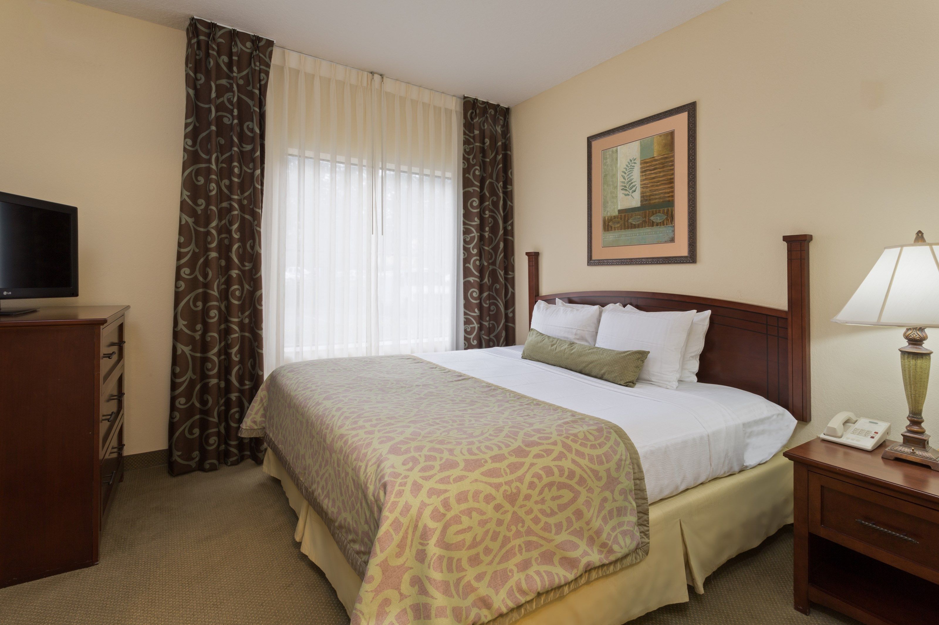 image Drift to sleep in the master bedroom with a King bed.