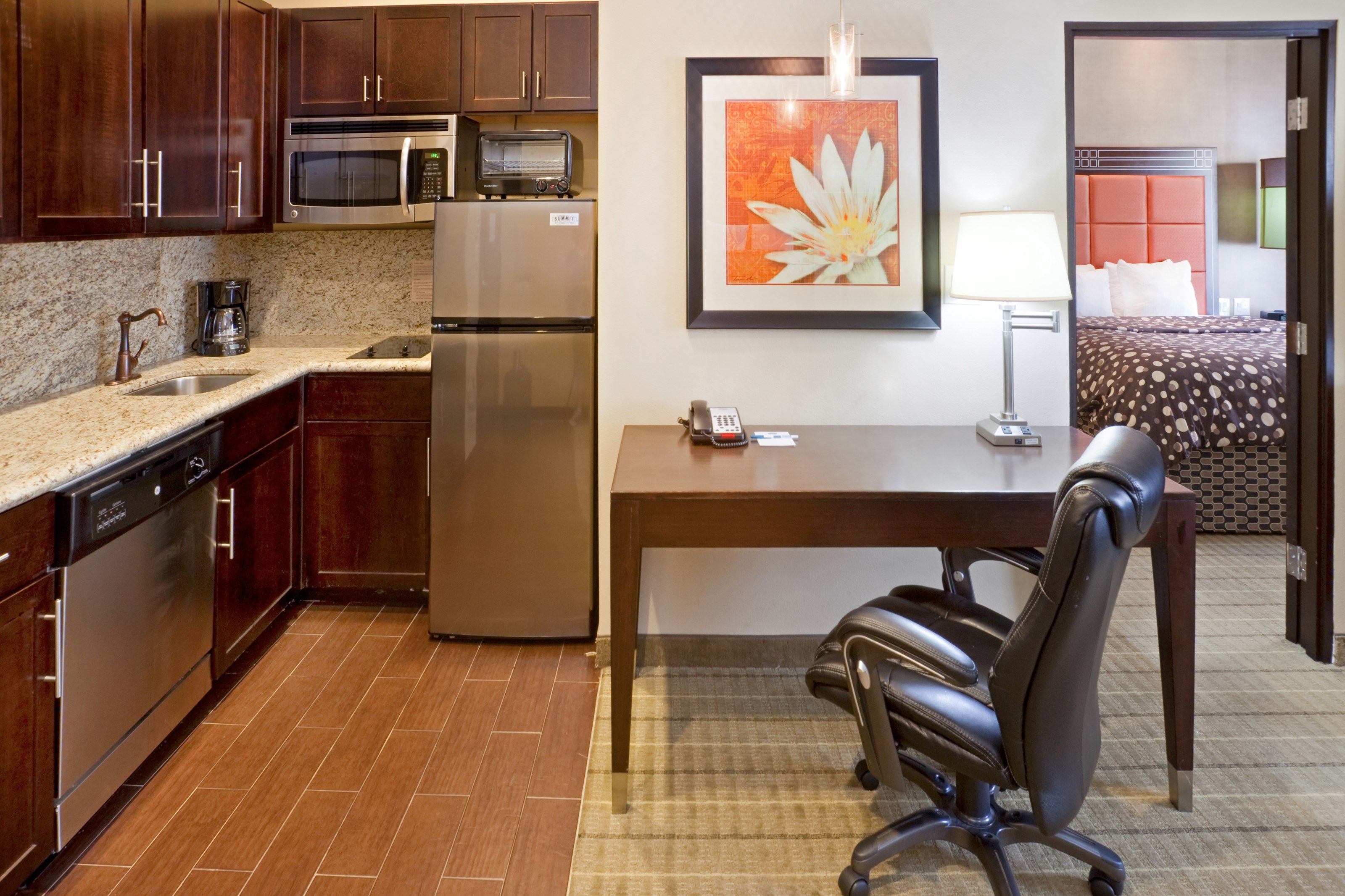 image Kitchen with granite countertops and full-size appliances.
