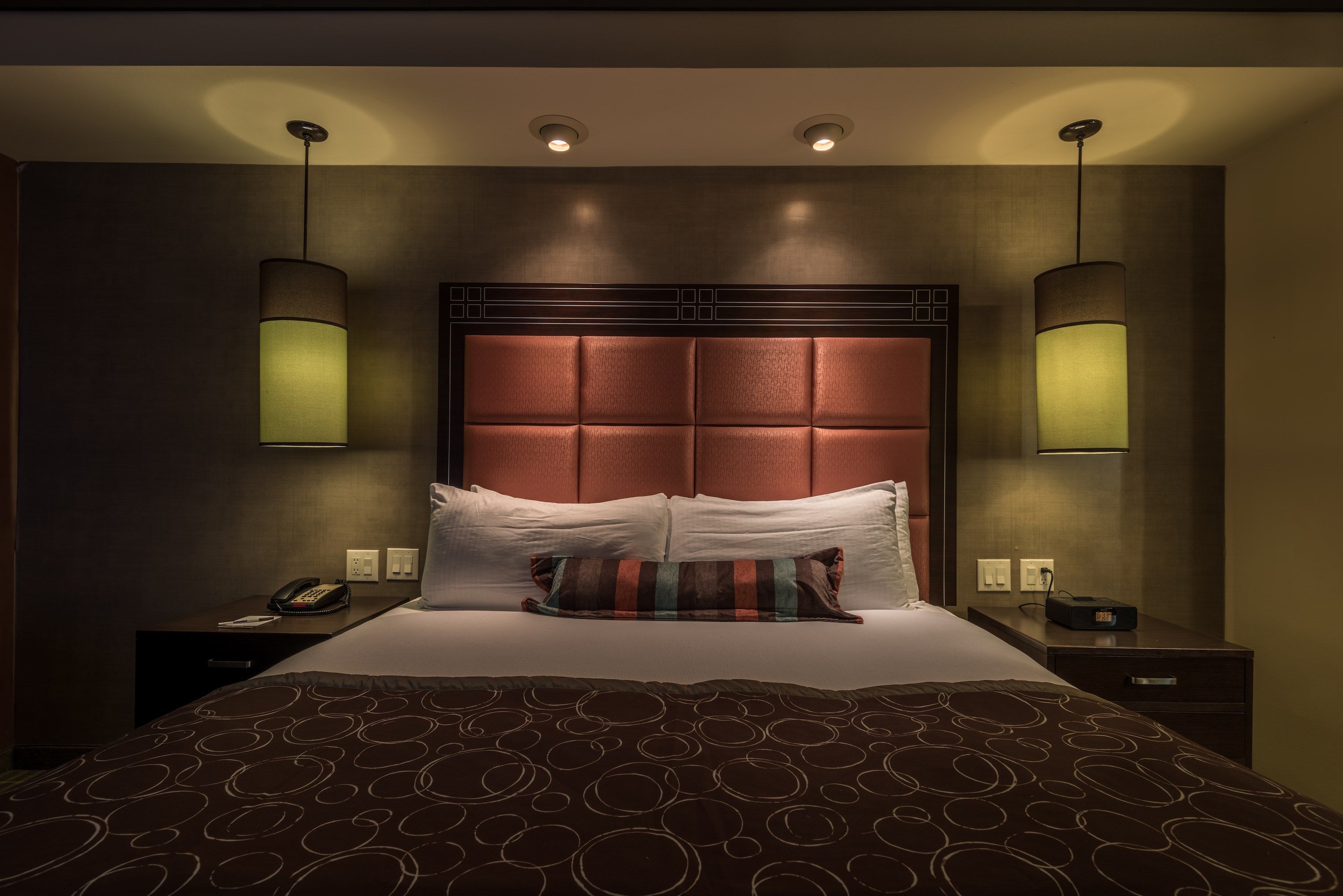 image Bedroom with queen bed, nightstand, and bedside lamps.