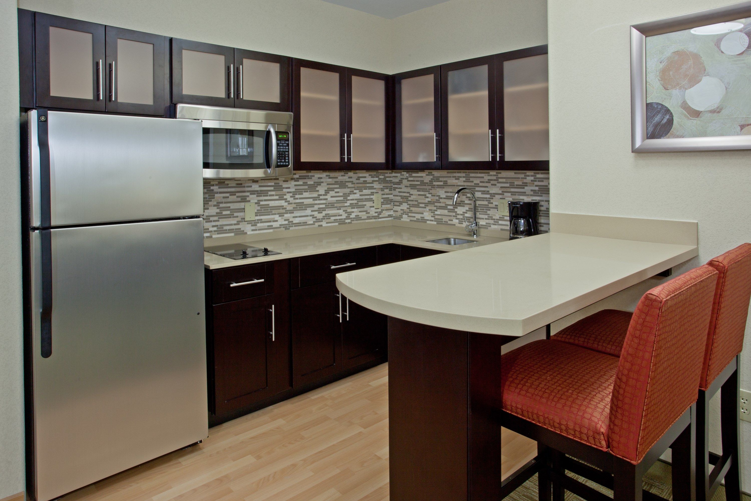 image Curb your appetite by cooking a meal in your kitchen.