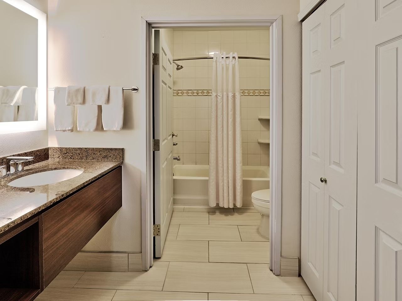 image Full bathroom with shower/tub combo, hair dryer, and complimentary toiletries stocked for your stay