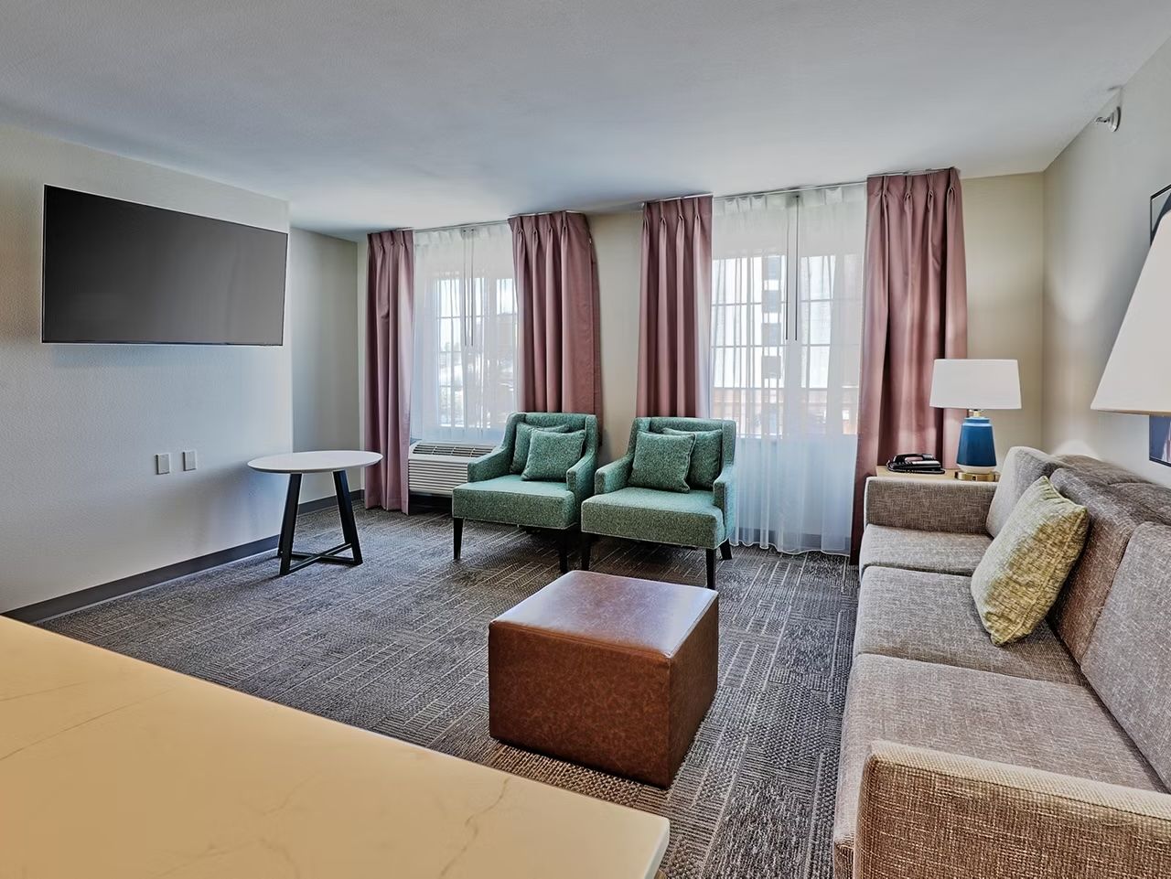 image Sofa bed and flat-screen TV in the living area — doubles as extra sleeping space when needed