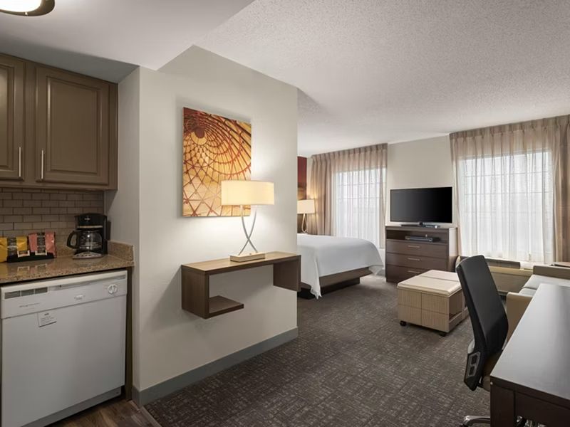 image Kitchenette with dining space and living area.