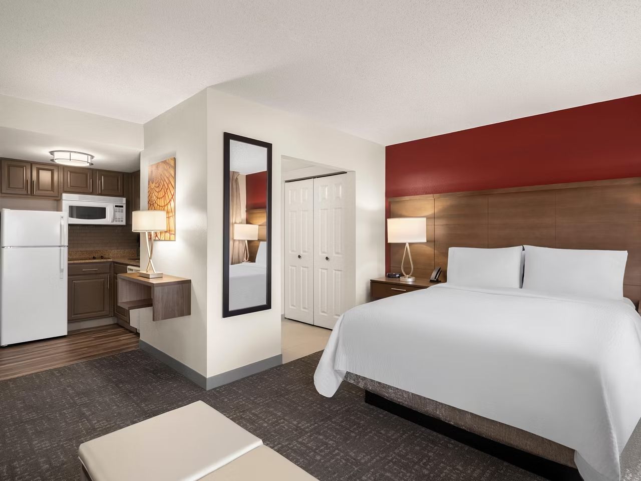image Open-plan suite with a queen bed and kitchenette.