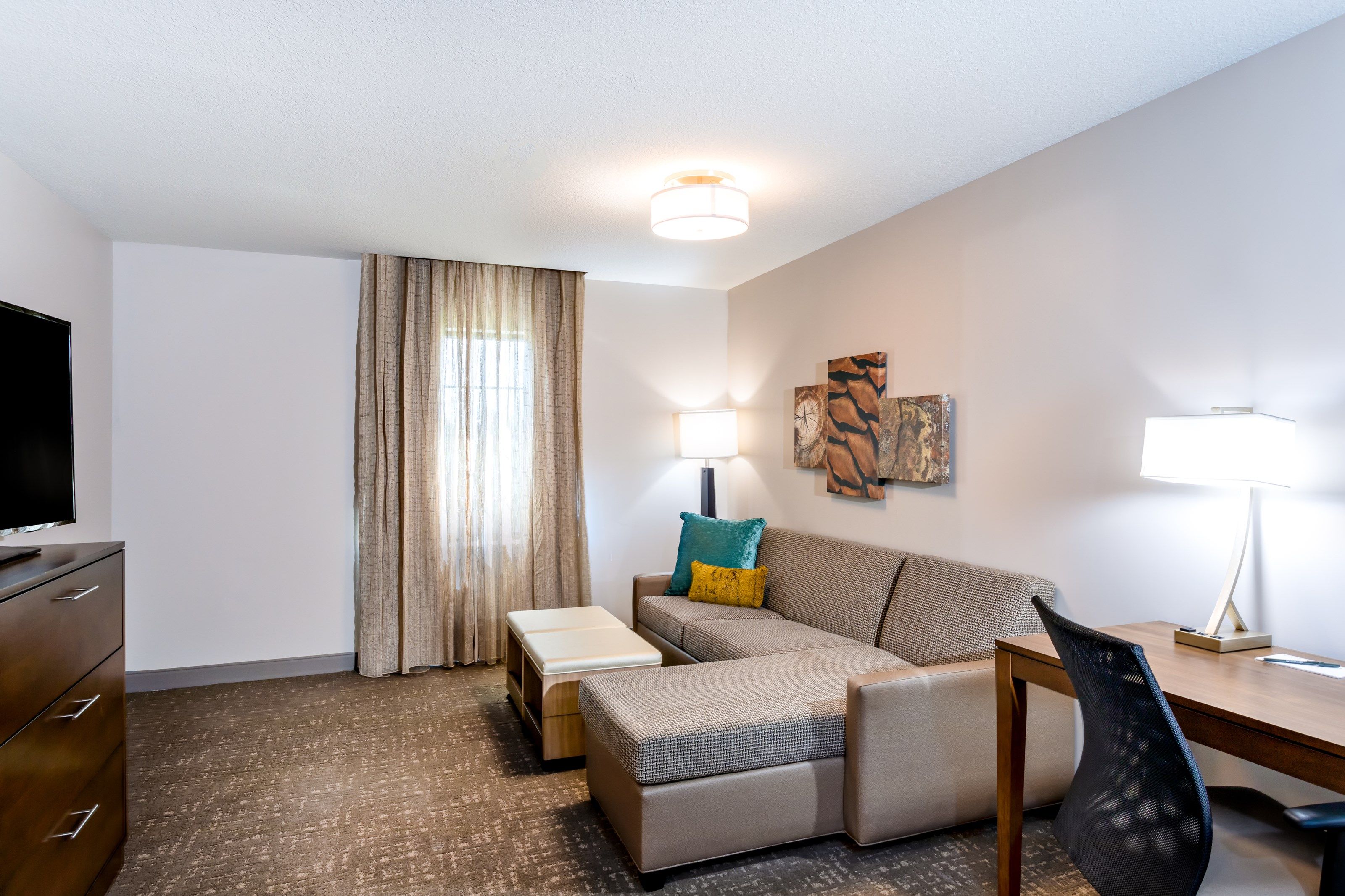 image Separate living area with sofa bed and flat-screen TV — space for everyone to spread out