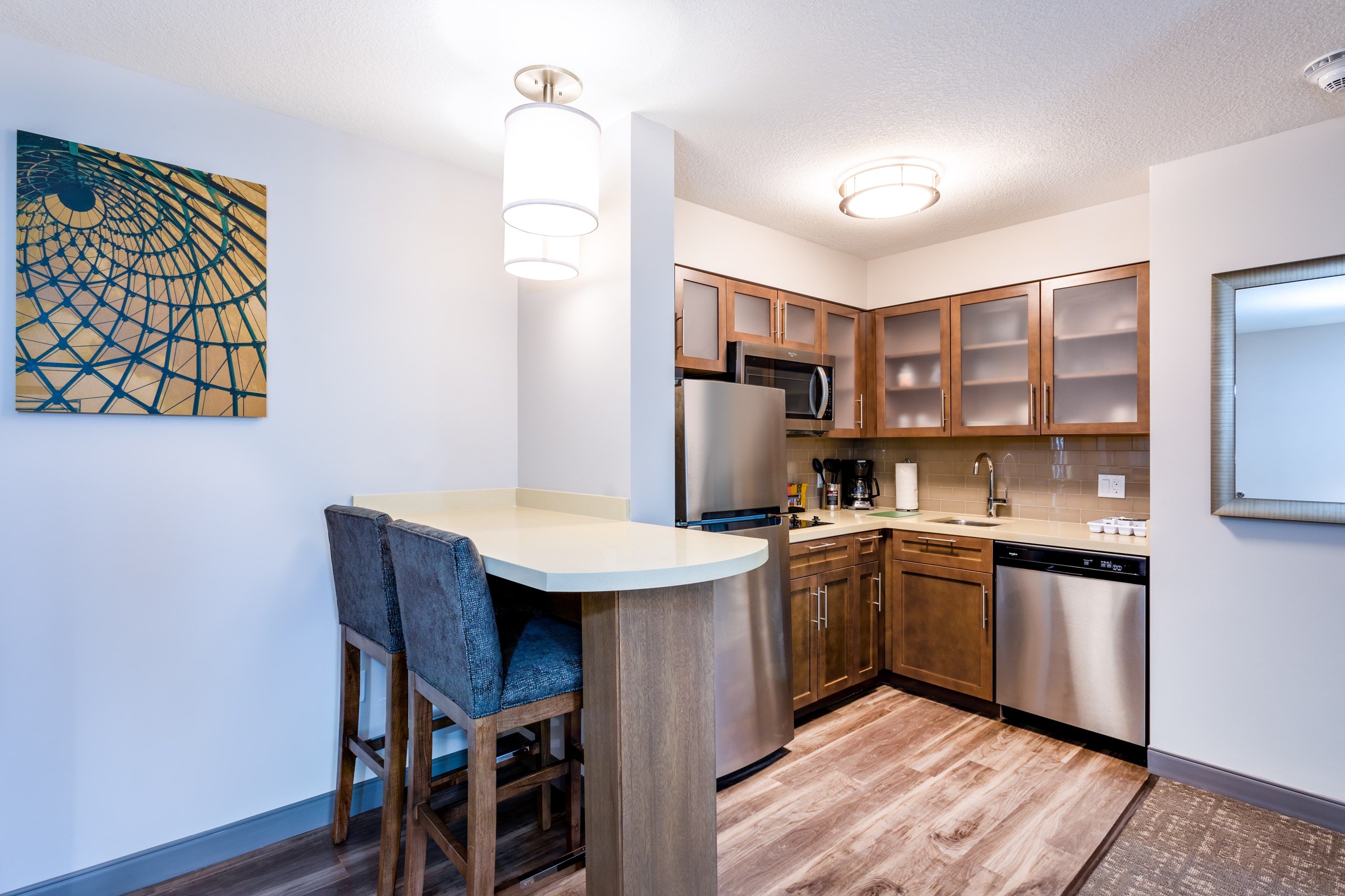 image Whip up a quick meal in the full kitchen — stovetop, dishwasher, microwave, and a bar that seats two