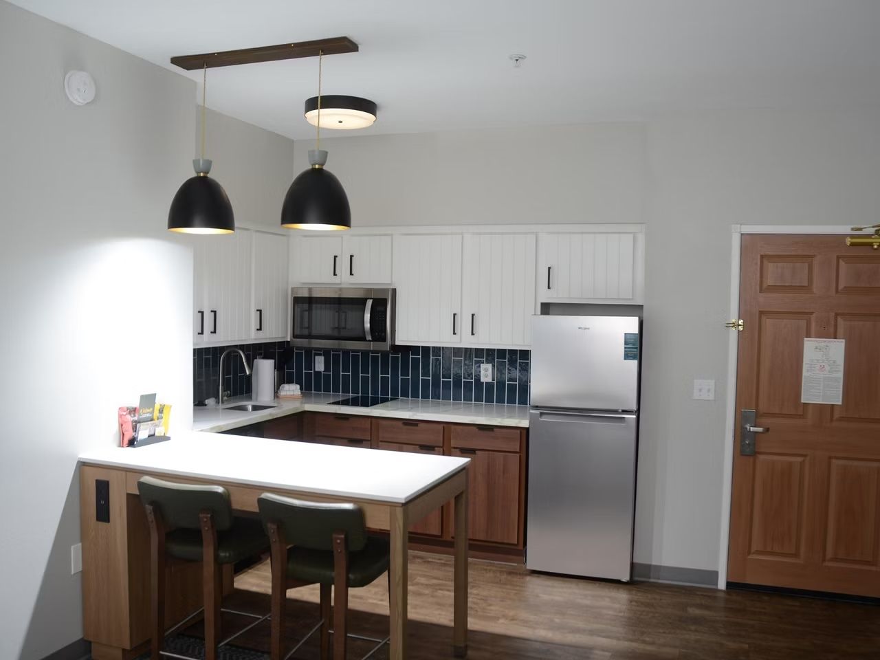 image Open concept layout, showcasing the full kitchen and dining space