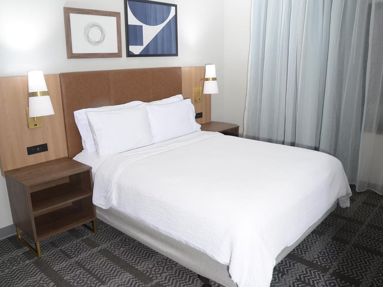 image Plush queen bed in a private bedroom.