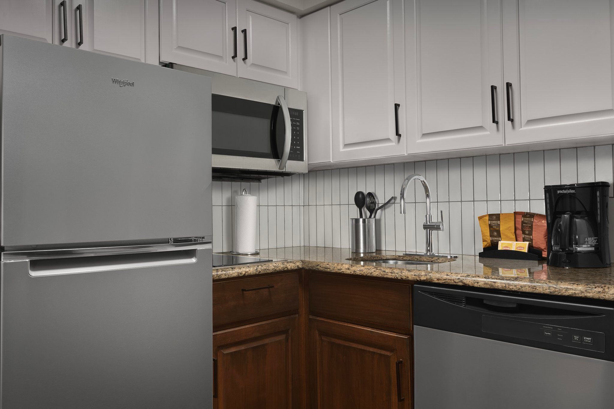 image Your culinary adventures begin here with modern appliances and ample counter space for meal prep.