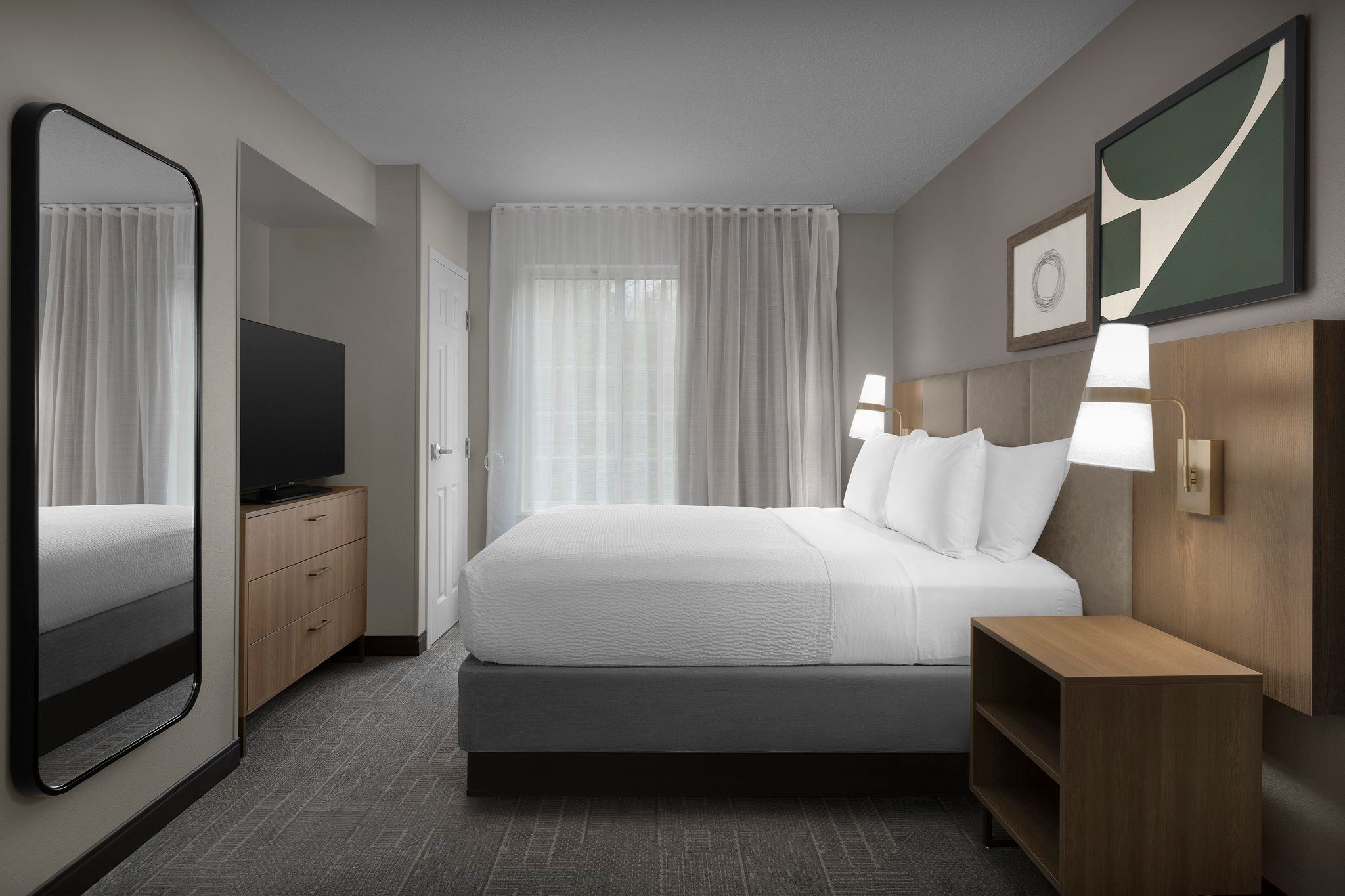 image Rest easy in a stylish bedroom with a plush Queen bed, perfect for unwinding after a day of adventure.