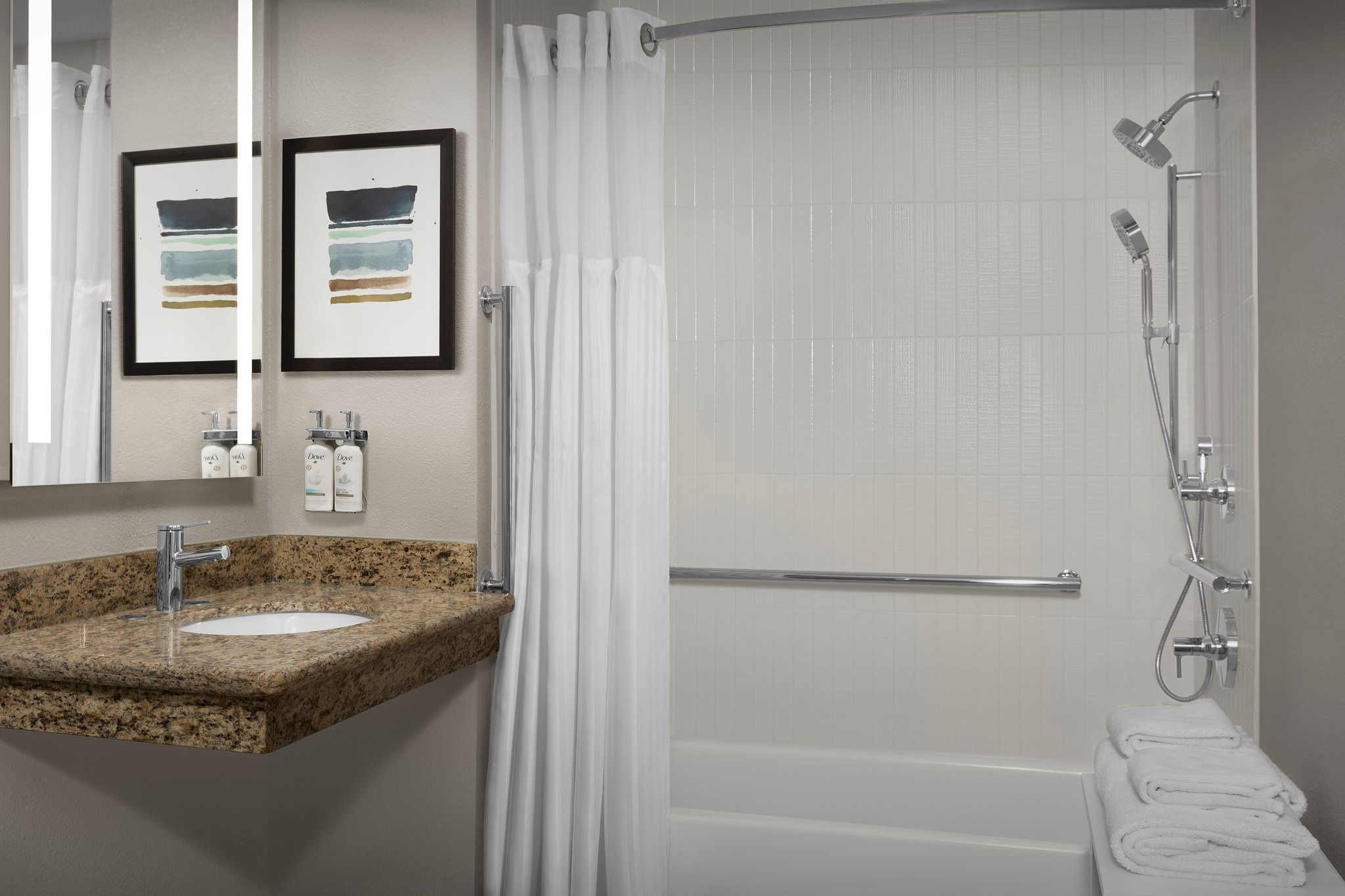 image Refresh in a well-appointed bathroom featuring modern fixtures and soft towels ready for your use.