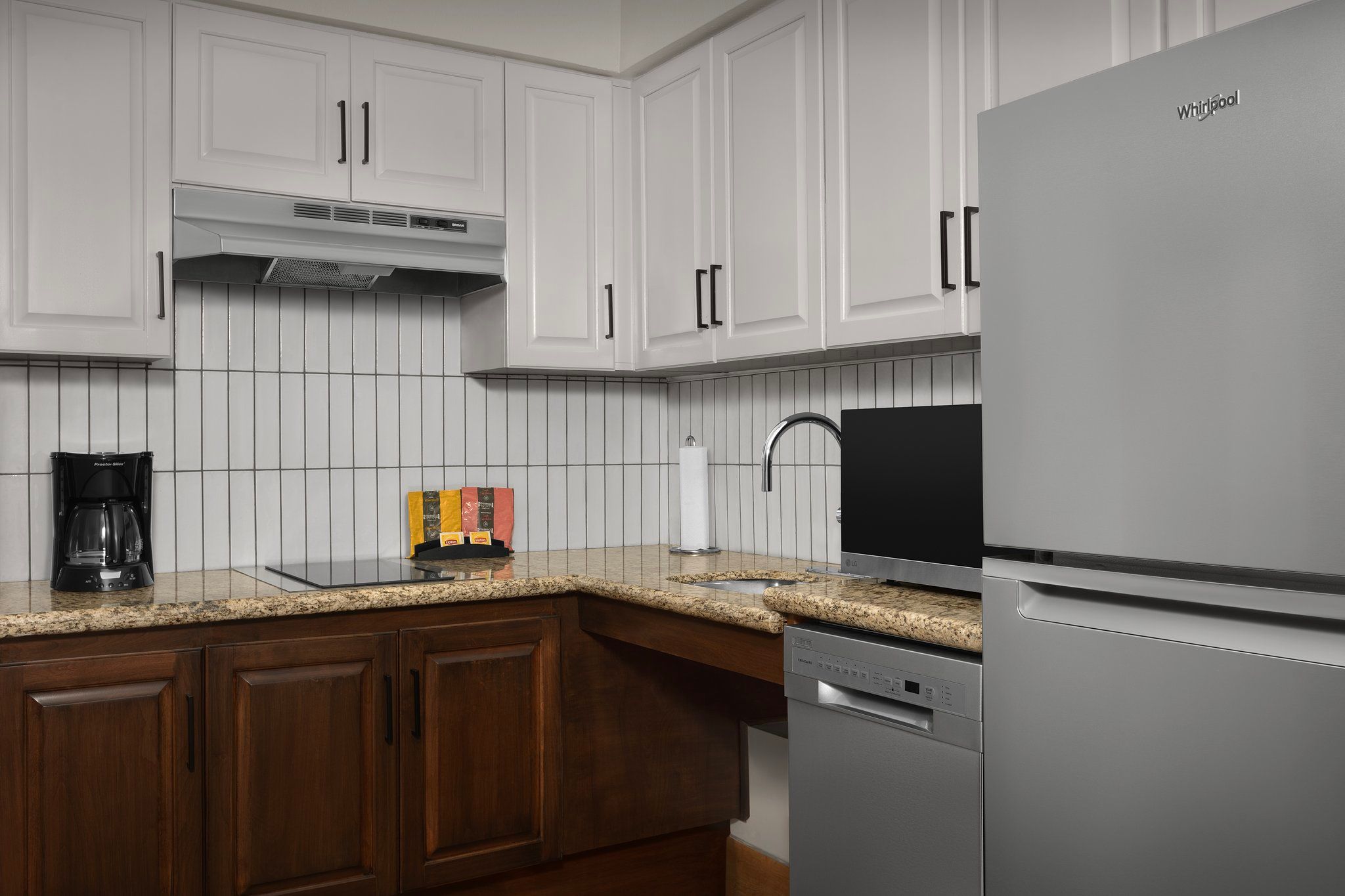 image Cook up a storm in a sleek kitchen, equipped with all the essentials for a delightful meal.