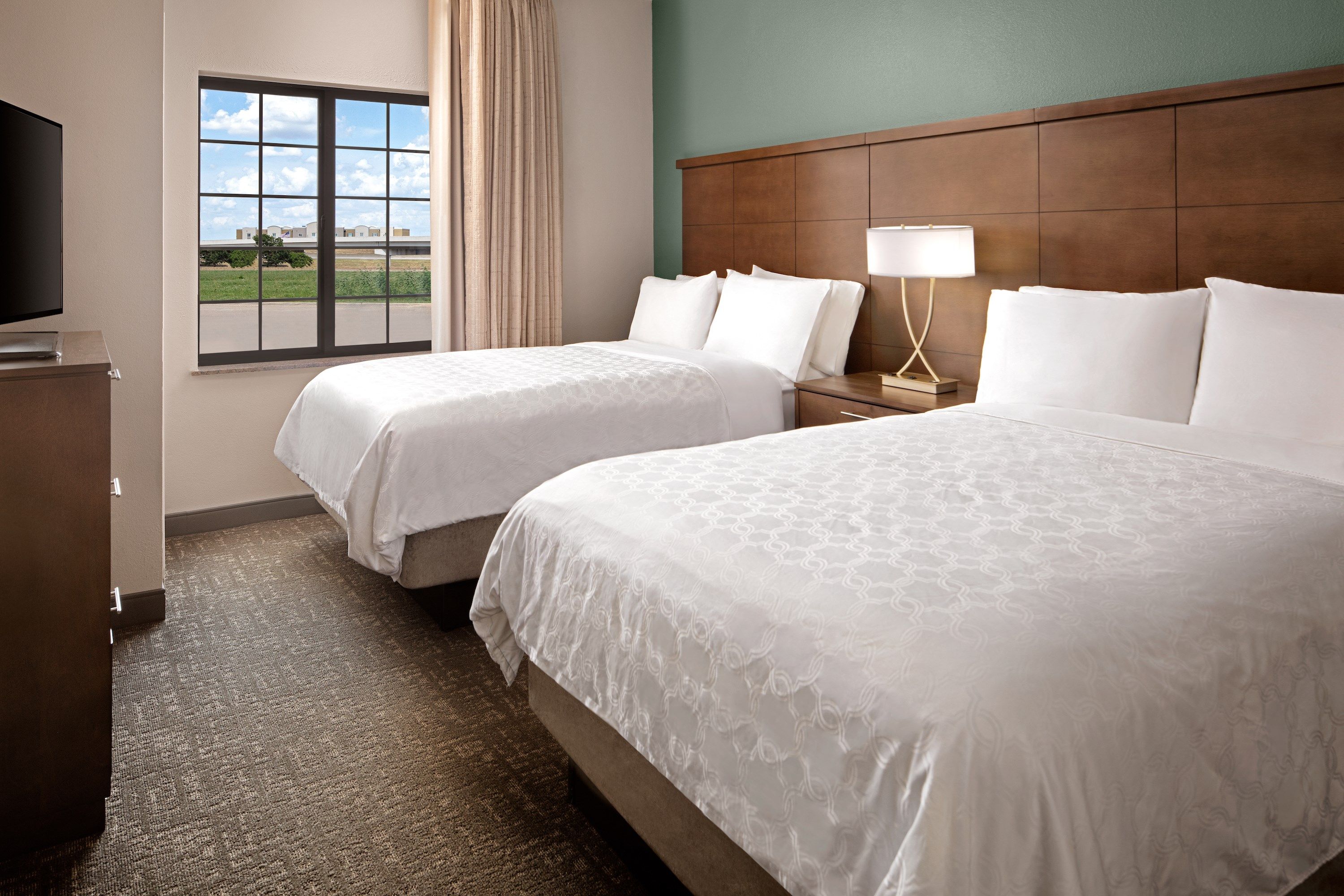 image Drift to sleep in a comfortable bed after a wonderful day outside.