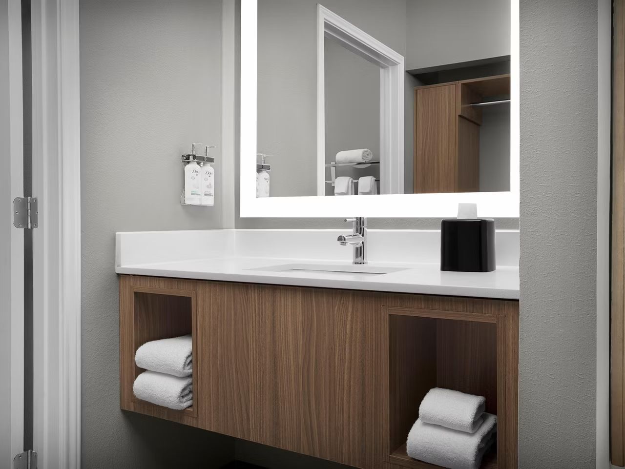 image Modern bathroom with vanity and ample storage.