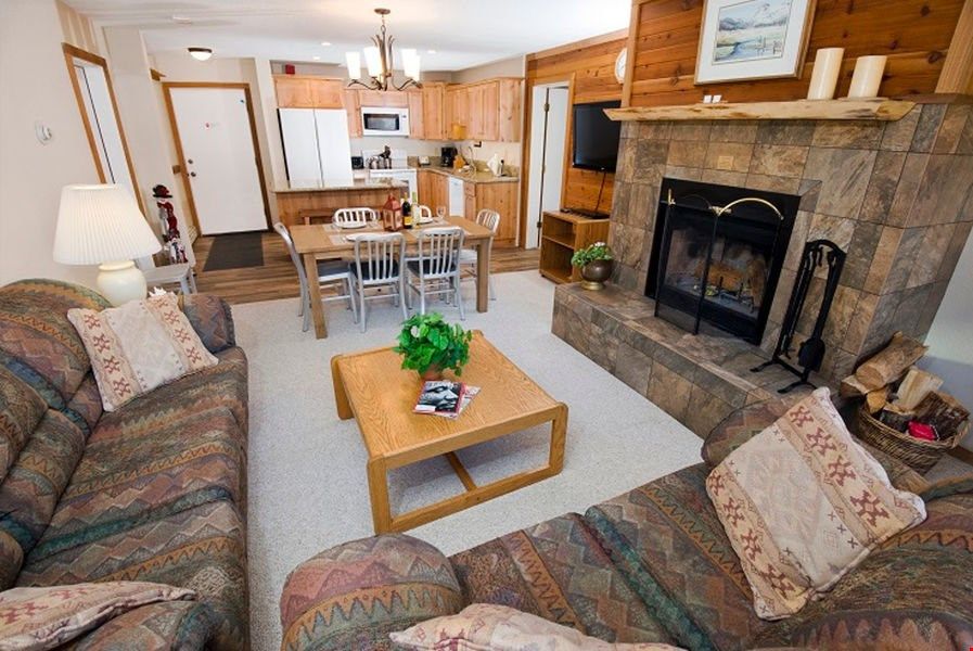 image Relax in the cozy living area, complete with fireplace