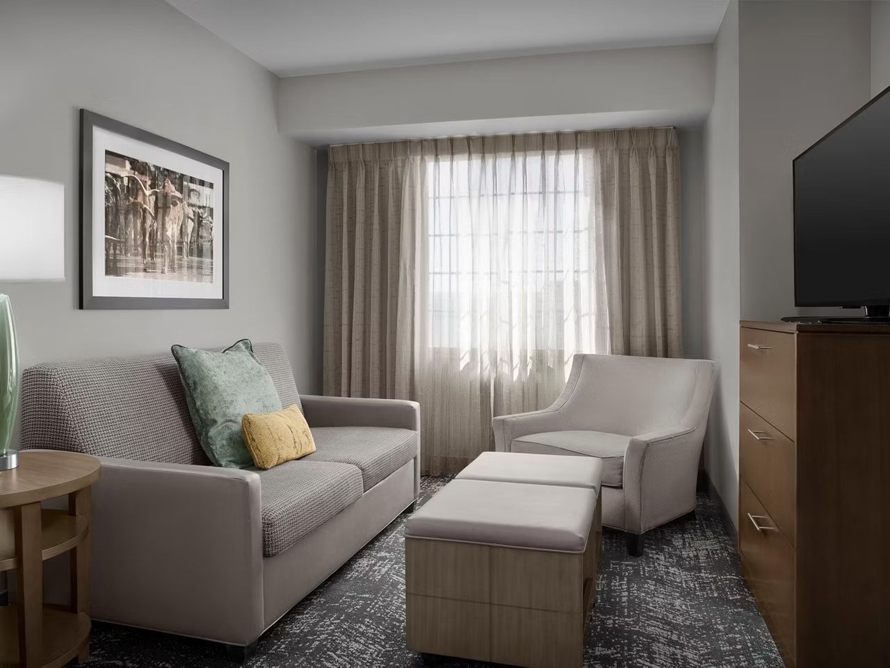 image Cozy living room with seating and natural light.