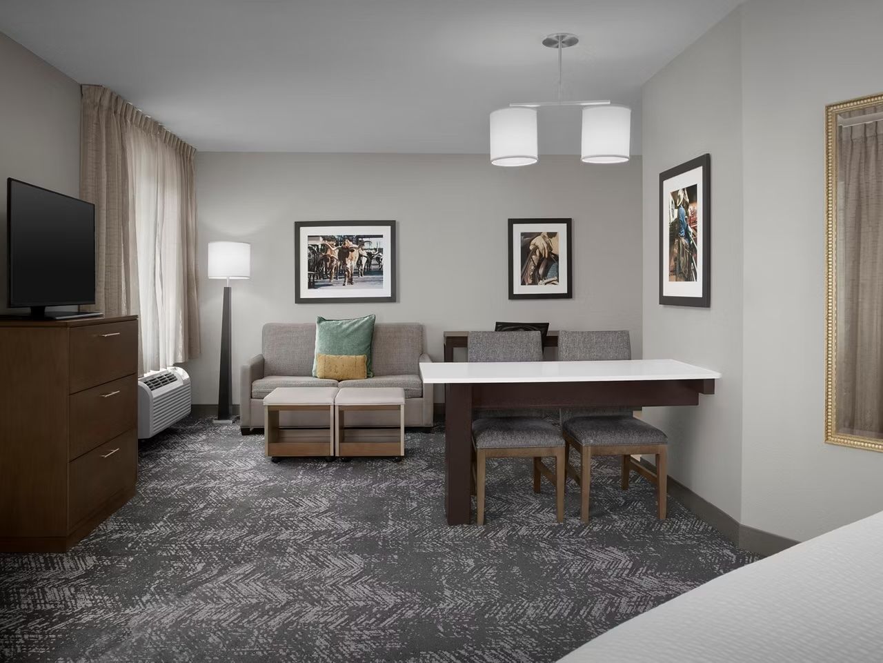 image Living area with sofa and flat-screen TV.