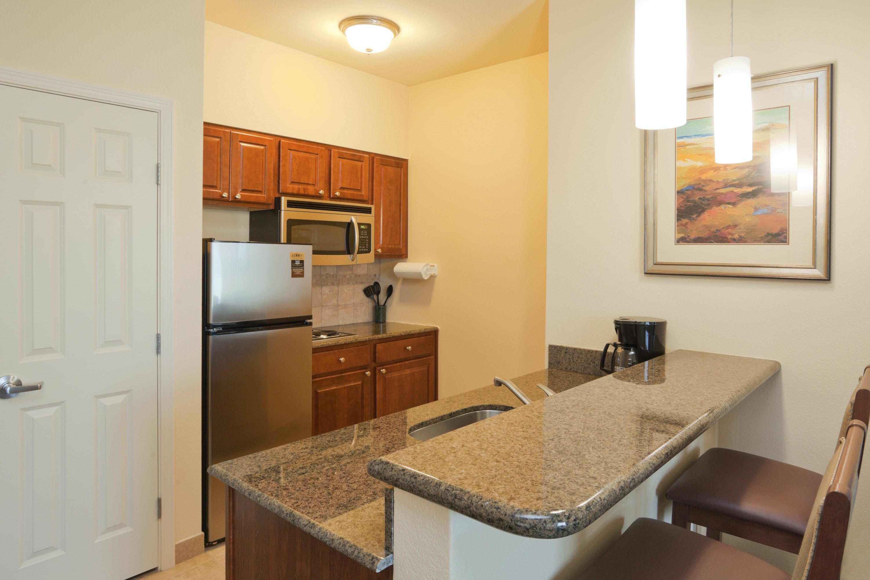 image Curb your appetite by cooking a meal in your kitchen.