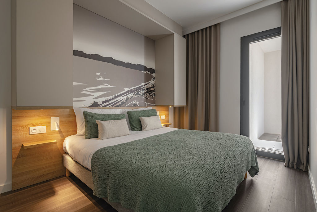 image Drift to sleep in a comfortable bed after a day outside.