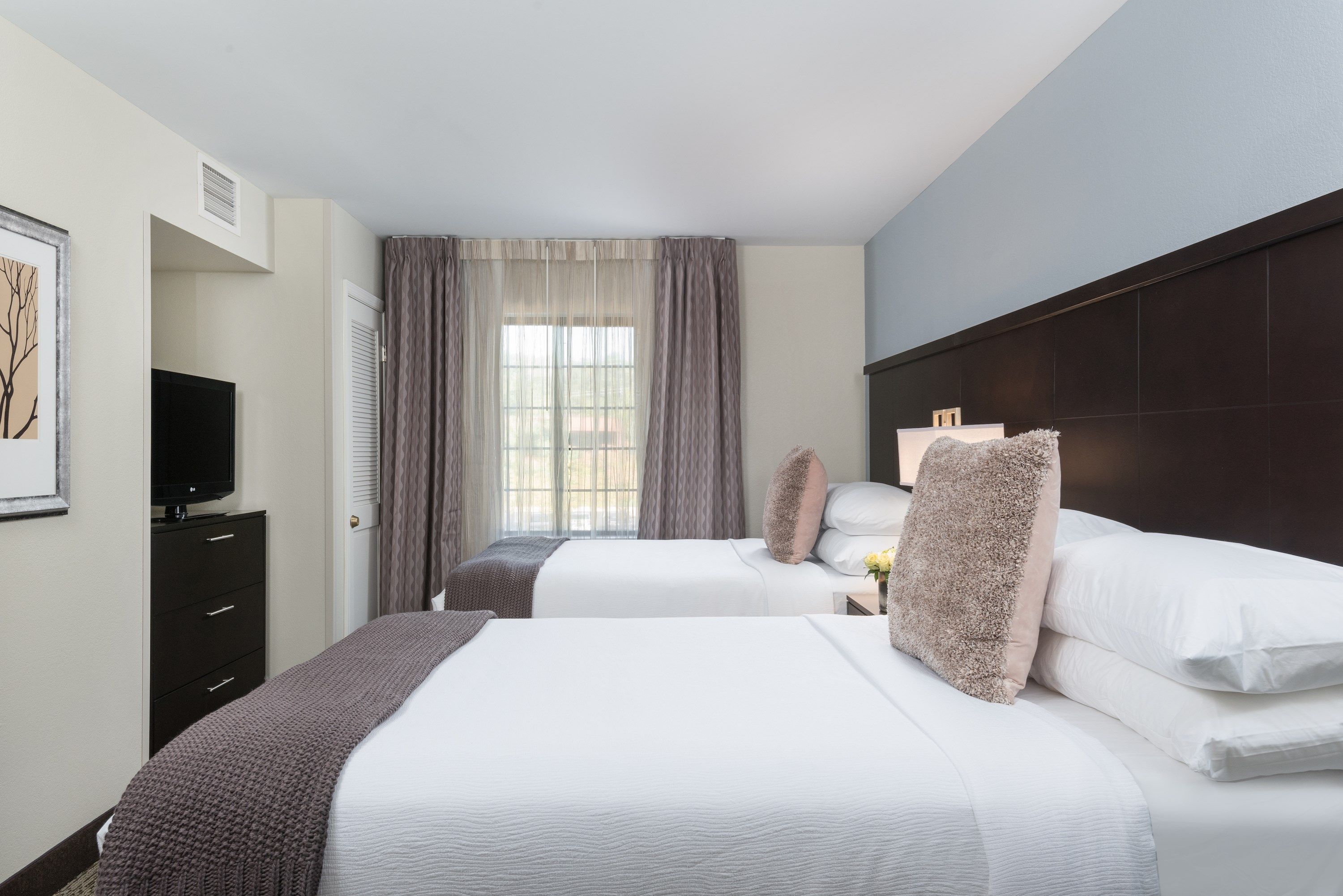 image Drift to sleep in a comfortable bed after a wonderful day outside.