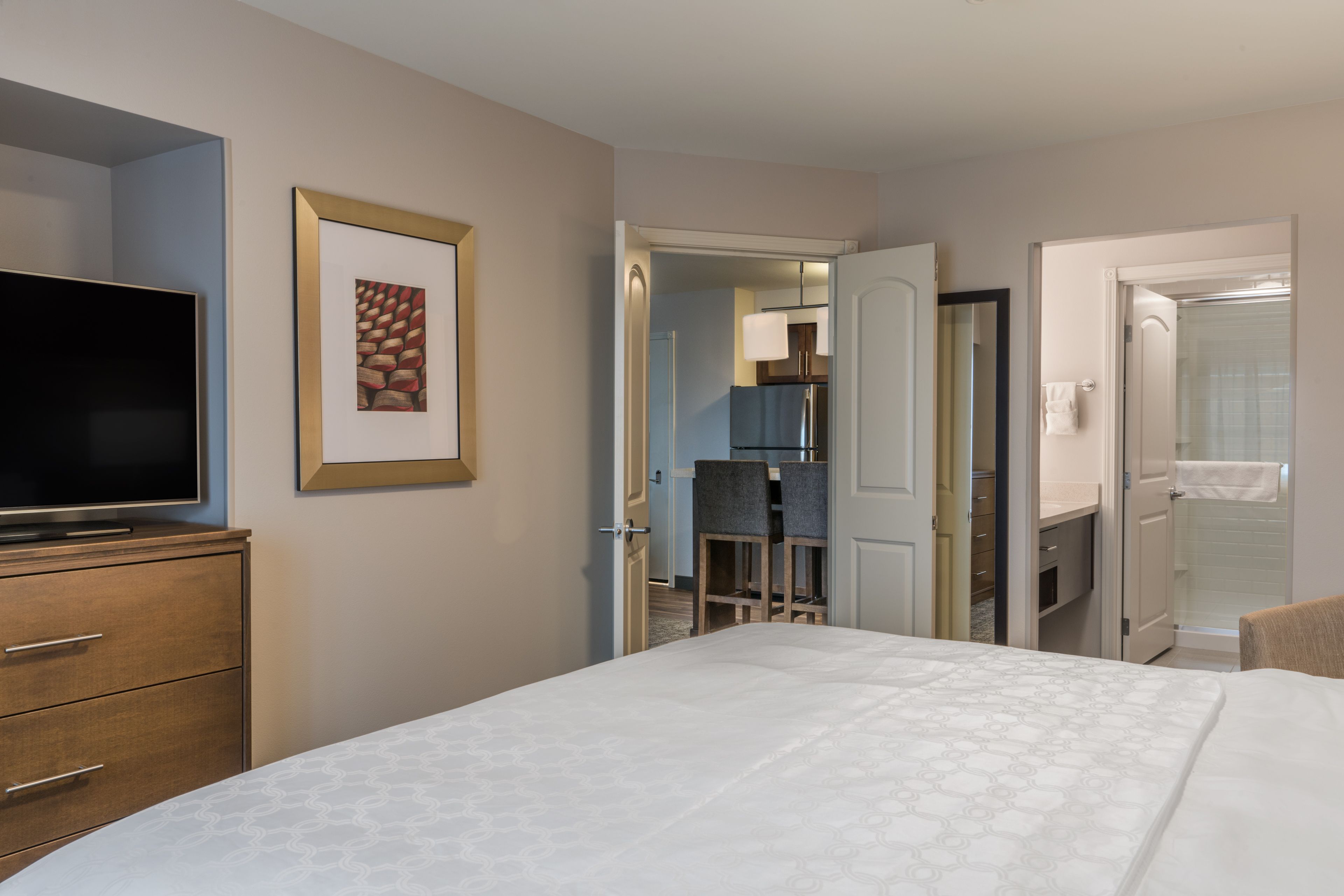 image Comfortable bedroom with flat-screen TV and en-suite access.