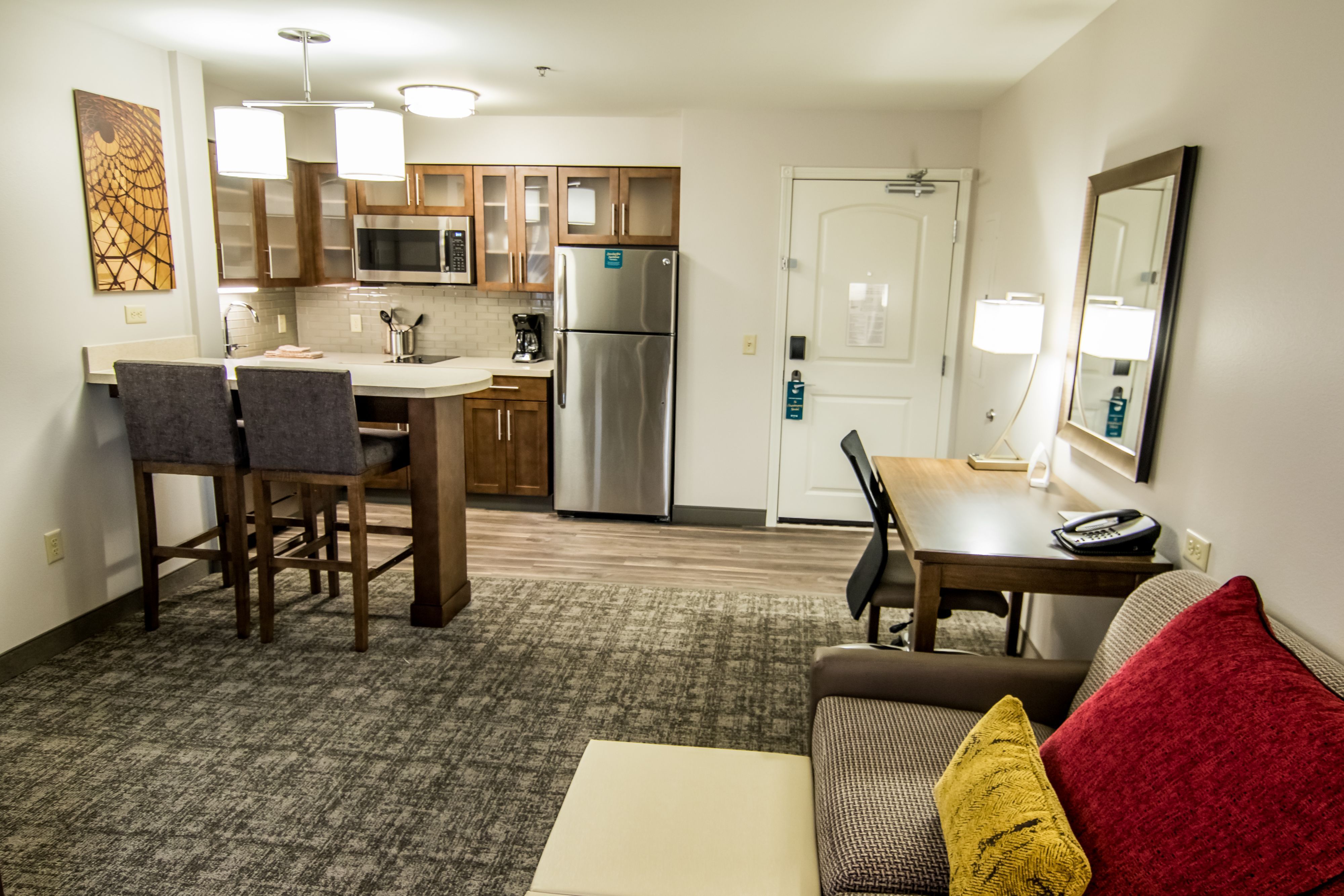 image Fully equipped kitchen with stainless appliances and dining area.