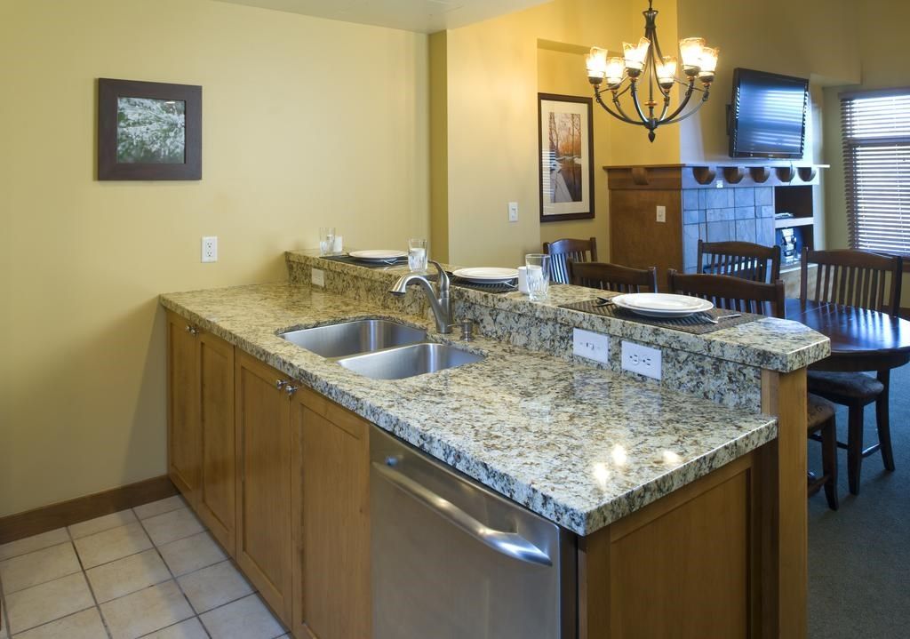 image The fully-equipped kitchen features a breakfast bar