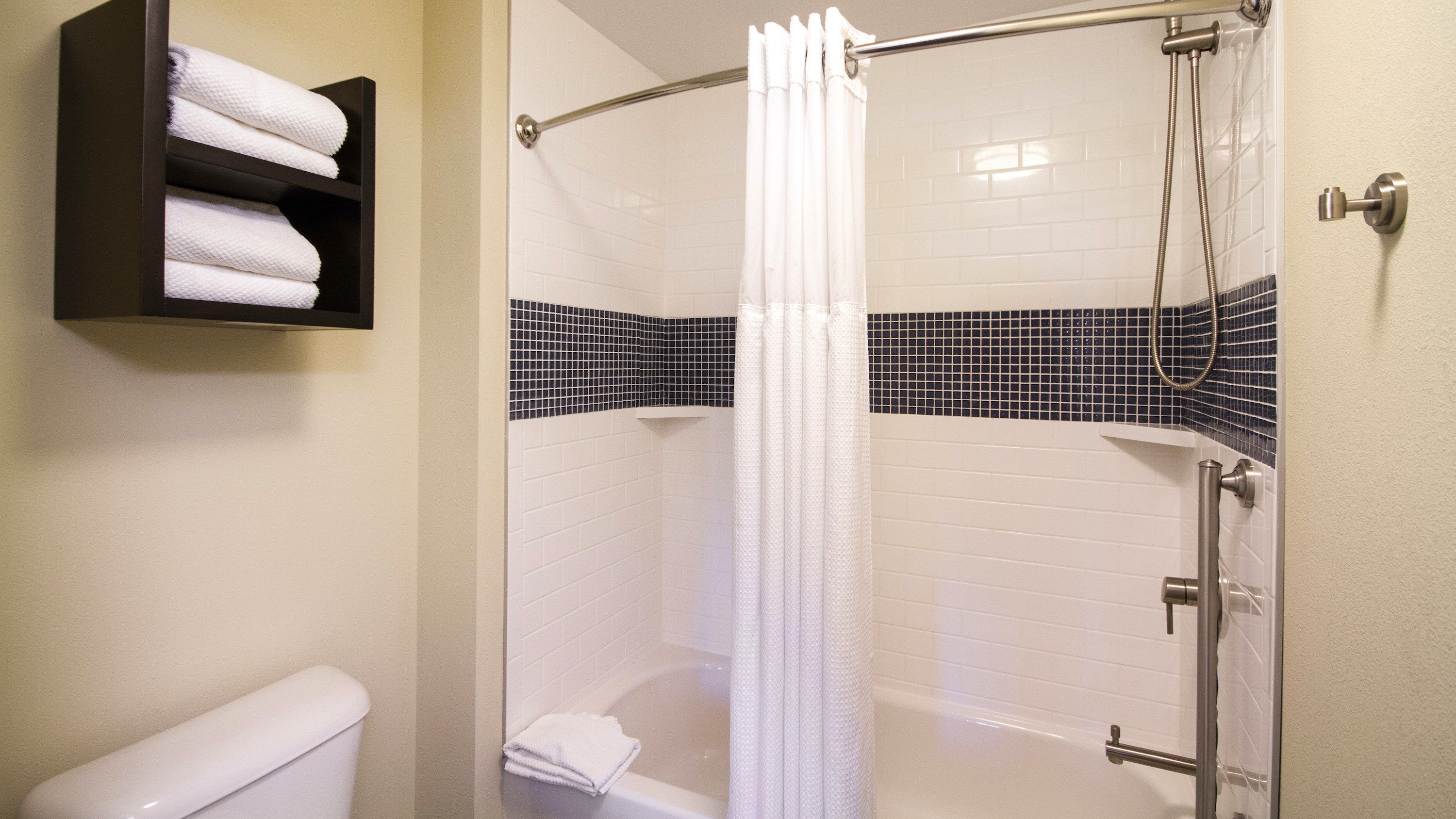 image Accessible bathroom with grab bars and a full bathtub