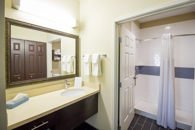 image Bathroom with walk-in shower and vanity