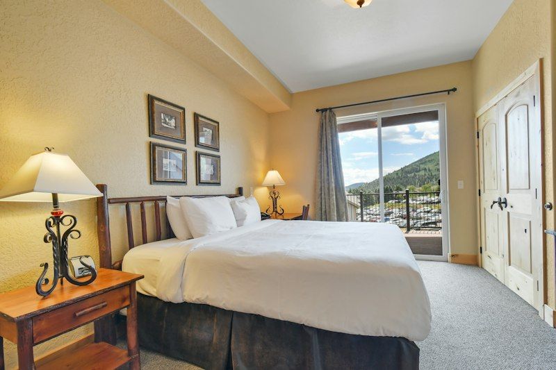 image Rest in the bedroom, with bedside lamps and patio door access