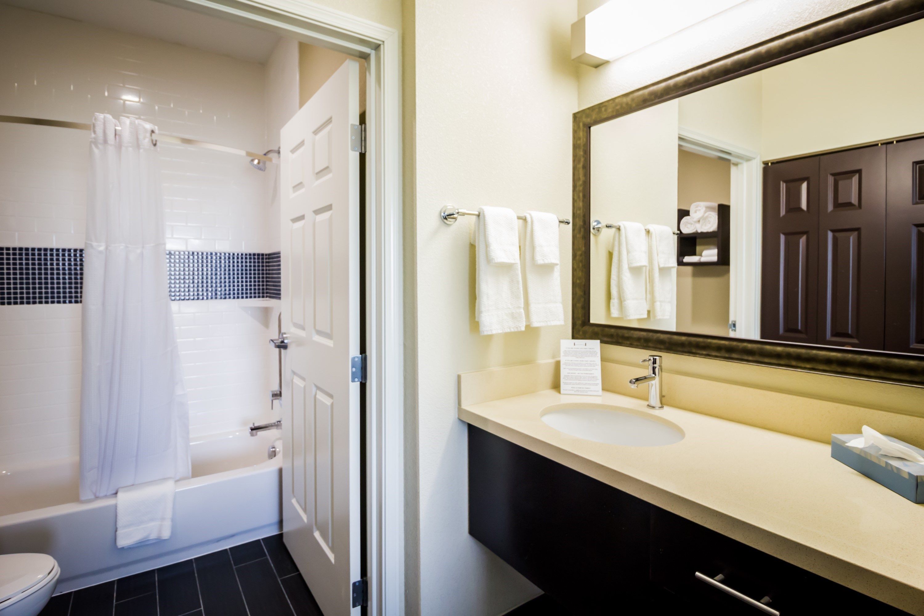 image Get ready for your day in the bathroom. Please note this unit has an accessible bath tub.