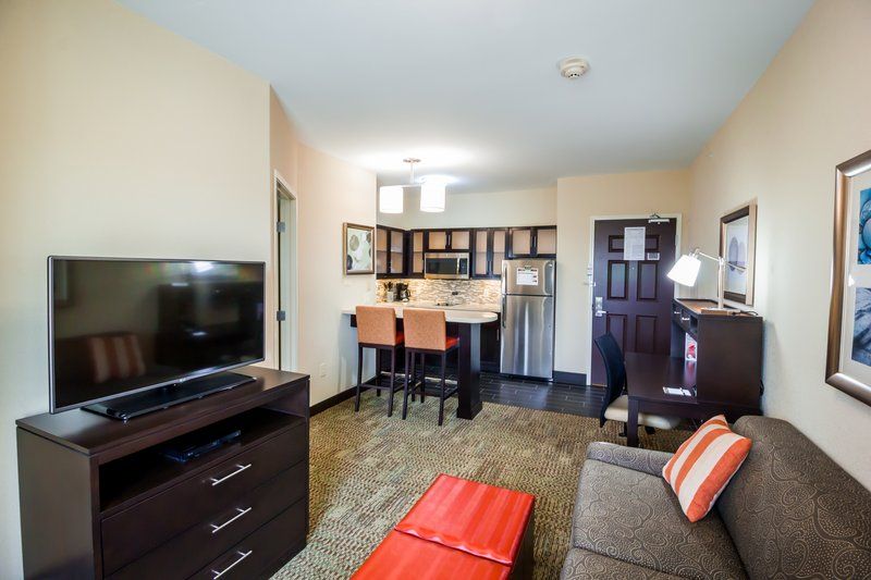 image Living area with dining table and kitchenette