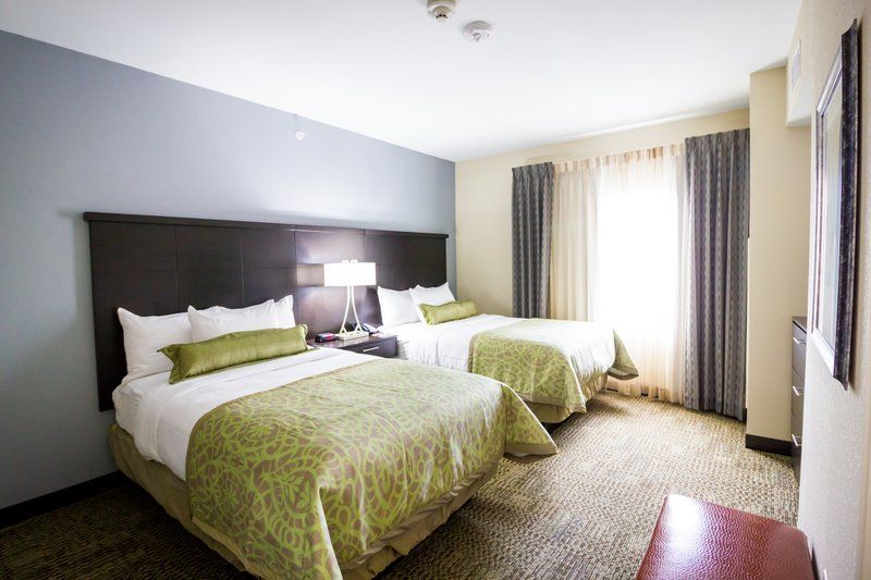 image Two queen beds with nightstands