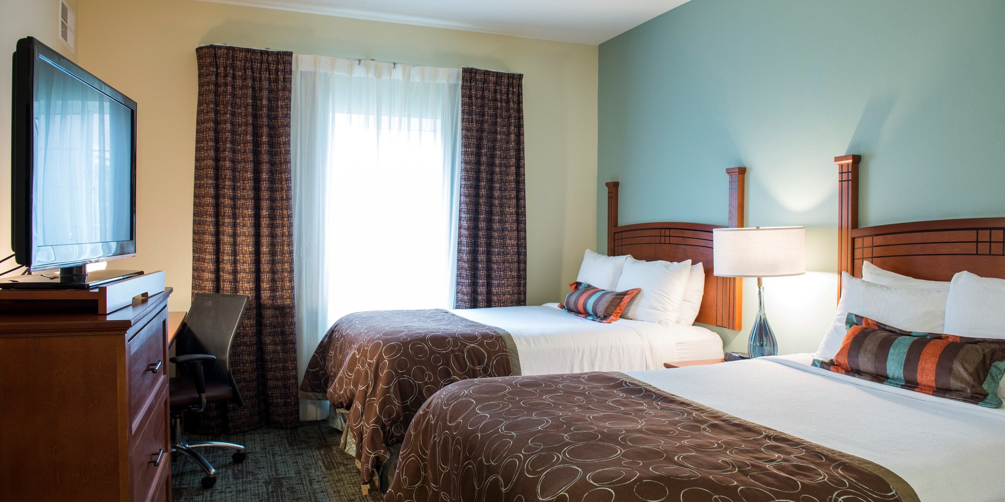 image Drift to sleep in a comfortable bed after a busy day.