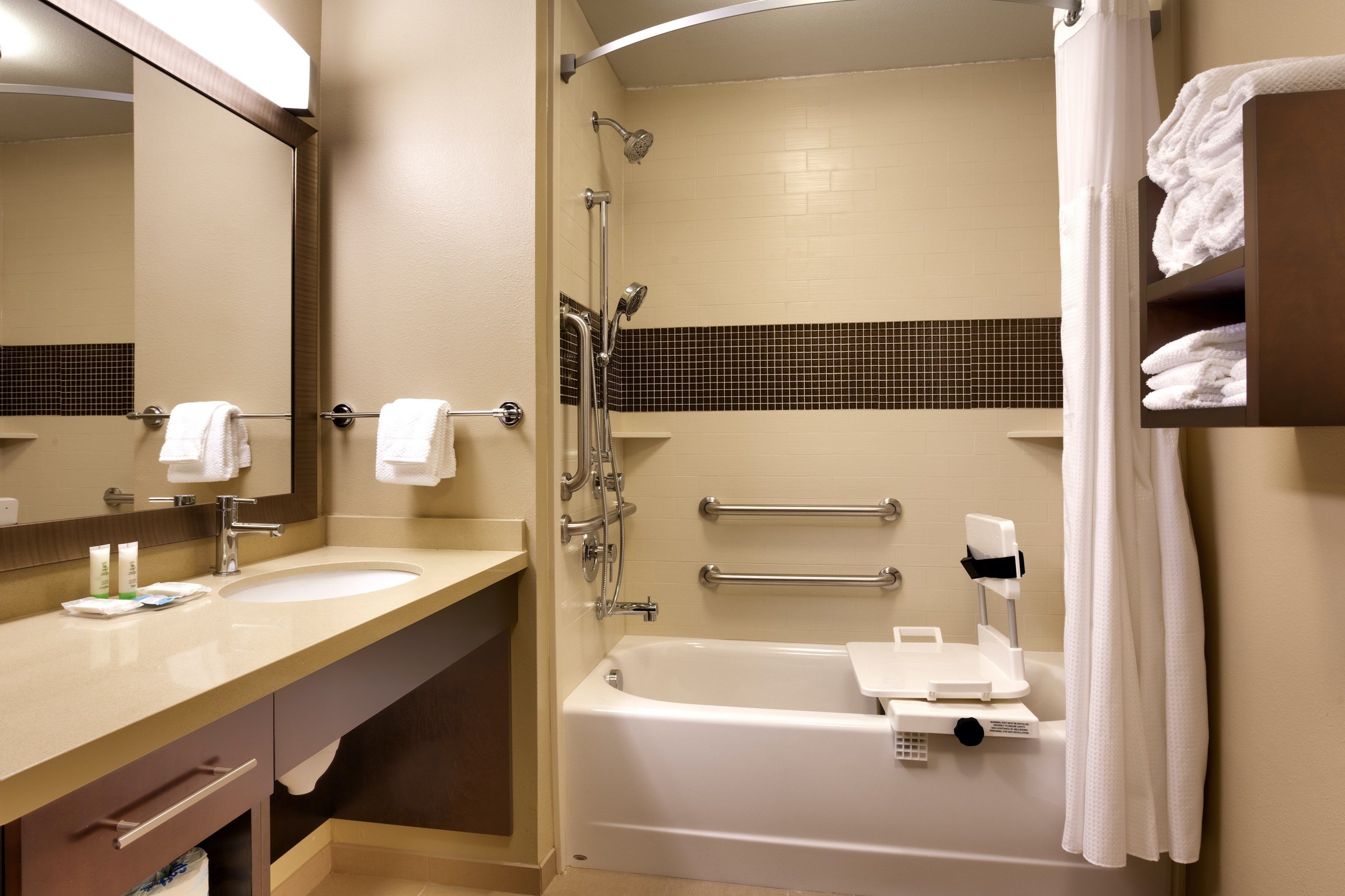 image The bathroom features an accessible tub.